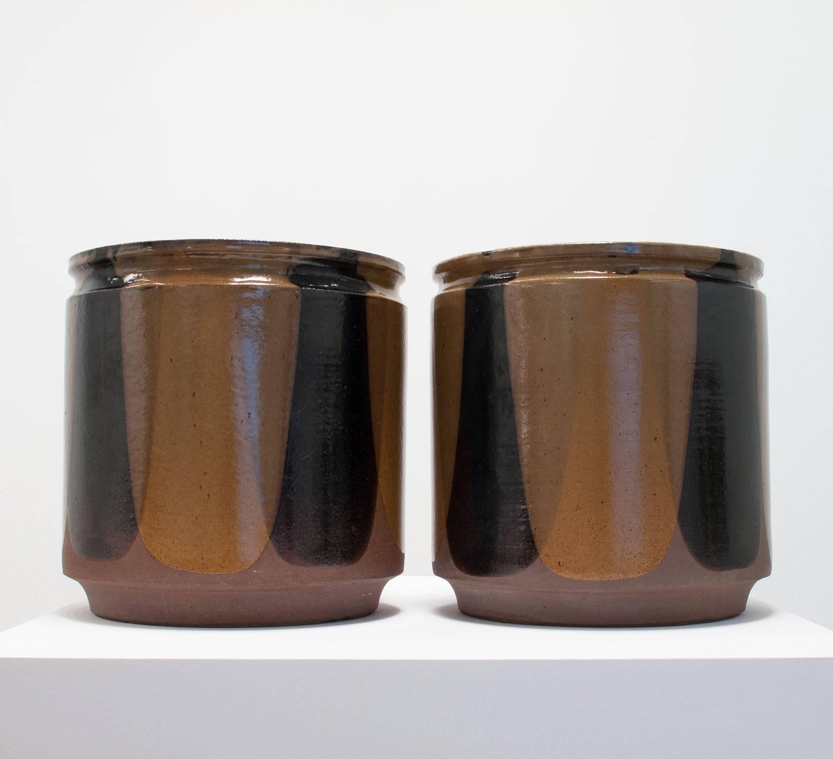 David Cressey and Robert Maxwell 'flame' design ceramic vessels, stoneware, glazed black and golden ochre, 1970s, Earthgender Ceramics, Los Angeles, California, 15.25 high x 15 diameter inches each, 31 pounds each.