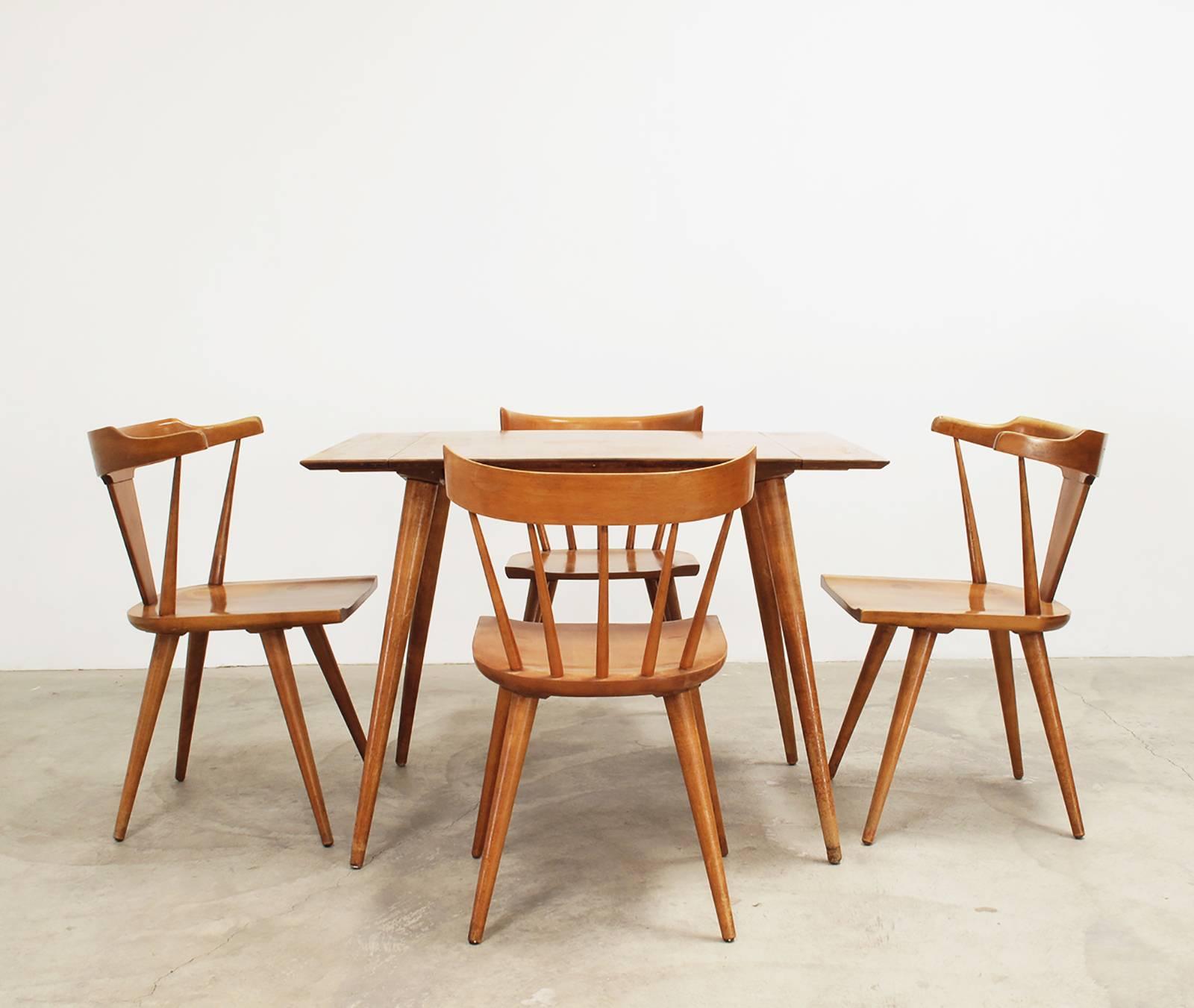 Vintage modern solid wood dinette set from the 'Planner Group' collection designed by Paul McCobb, 1950s, dimensions of chairs: 31 high x 19.5 wide x 19.5 deep, 17.5 seat height inches, dimensions of table with both leaves: 29 high x 60.5 wide x 30