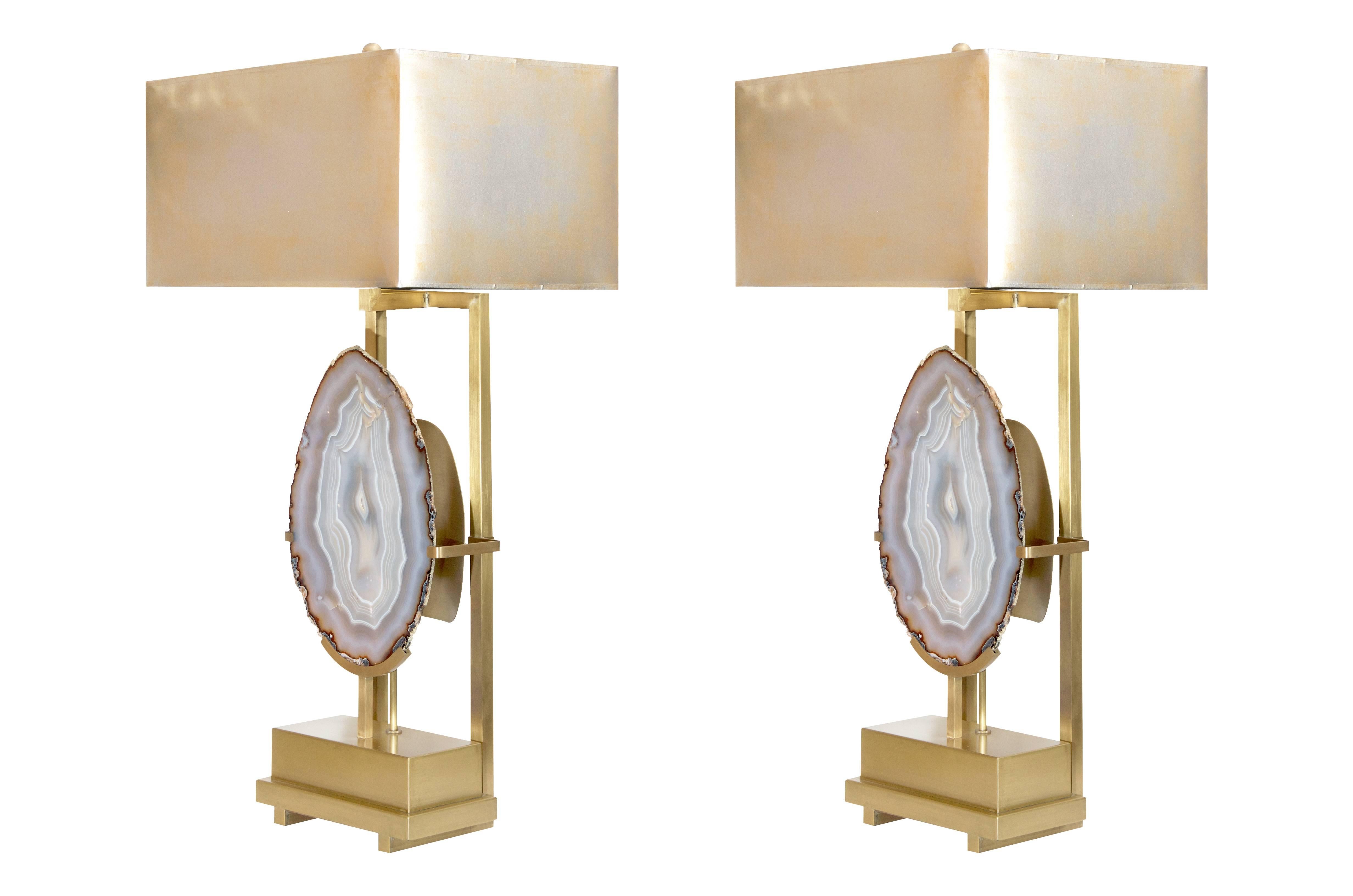 Impressive pair of custom designed lamps for the Modern Envy collection exclusively by On Madison featuring large slices of Brazilian agate set into brushed brass bases. custom-made metallic shades. 11-12 week production time.

With shade: 33.5h x