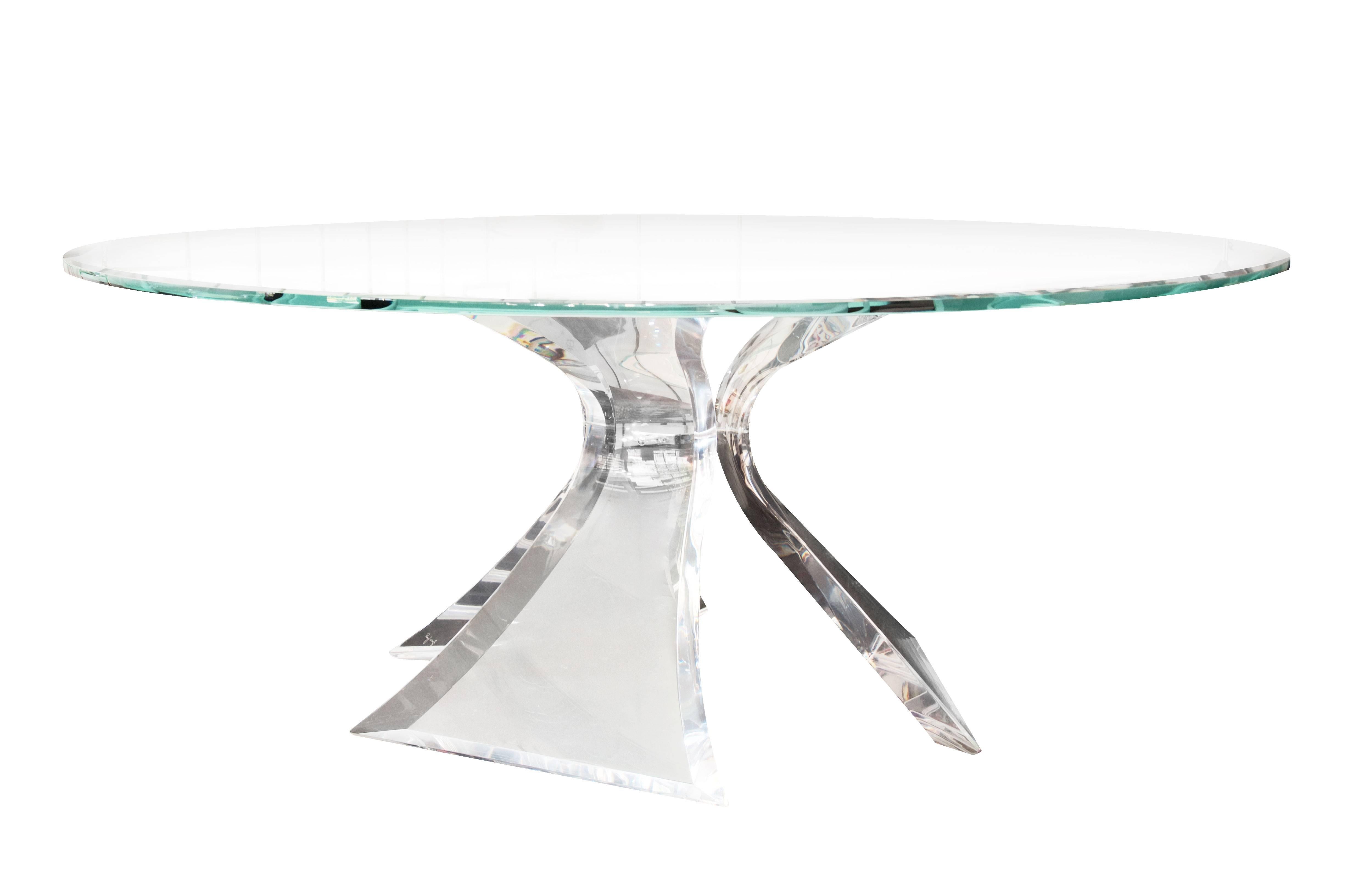 Magnificent Lucite table by Lion in Frost, custom-made. Signed Lion in Frost, circa 1983. Table base is comprised of three curved panels of Lucite, each panel 4” in thickness. Glass tabletop was custom-made for the base and has been etched with a
