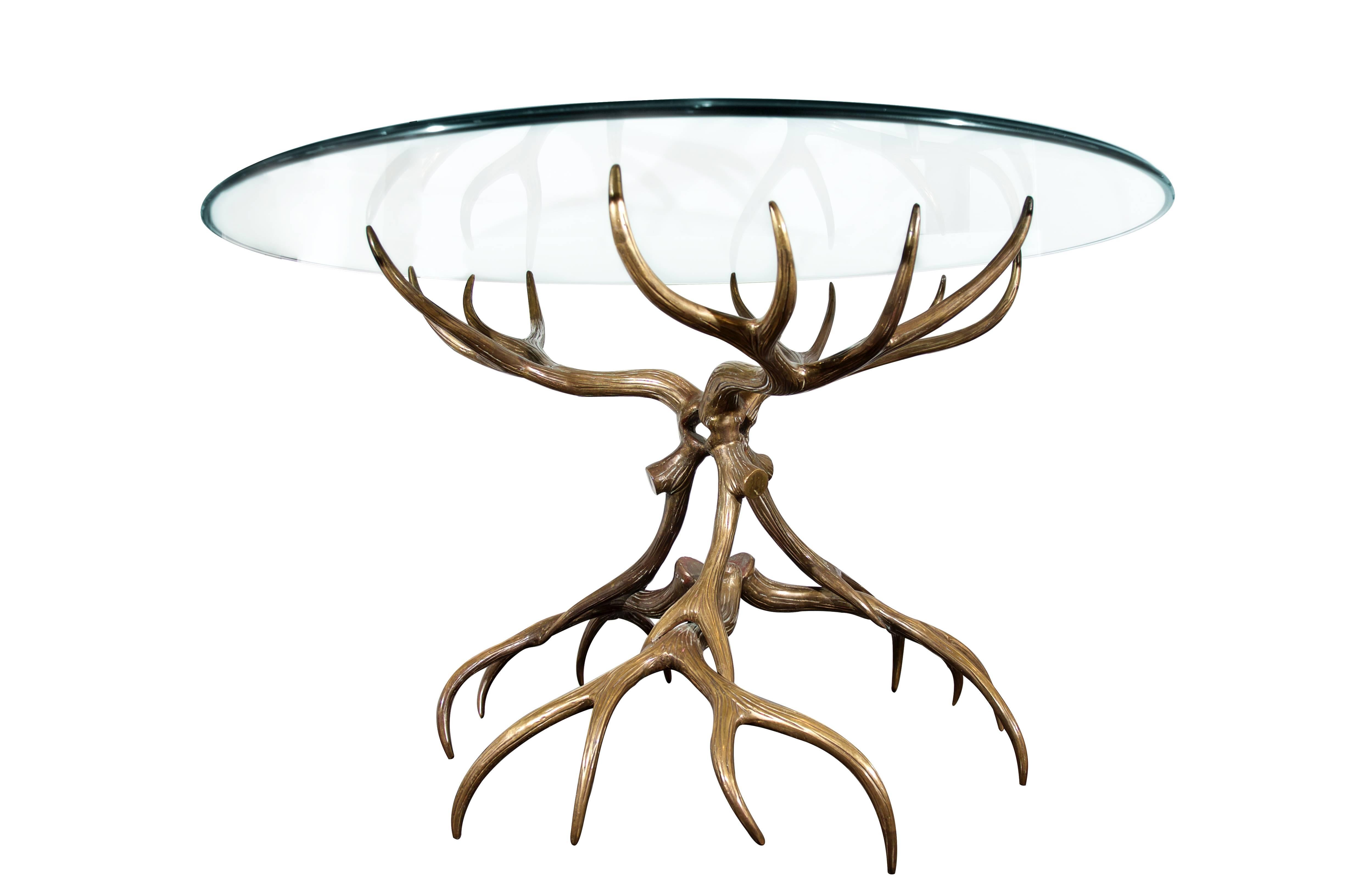 Spectacular bronze antler table, late 1970s, in the manner of Arthur Court. Solid cast, not hollow. This piece is very heavy and makes quite a statement.

Base dimensions: 32