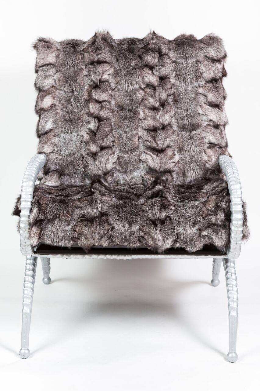 Rare pair of cast aluminum Sable Horn Chairs by Arthur Court, 1950s. Created to mimic the horns of an African sable antelope these chairs have been
newly restored in a metallic silver powdercoat and upholstered in genuine silver fox fur.
 