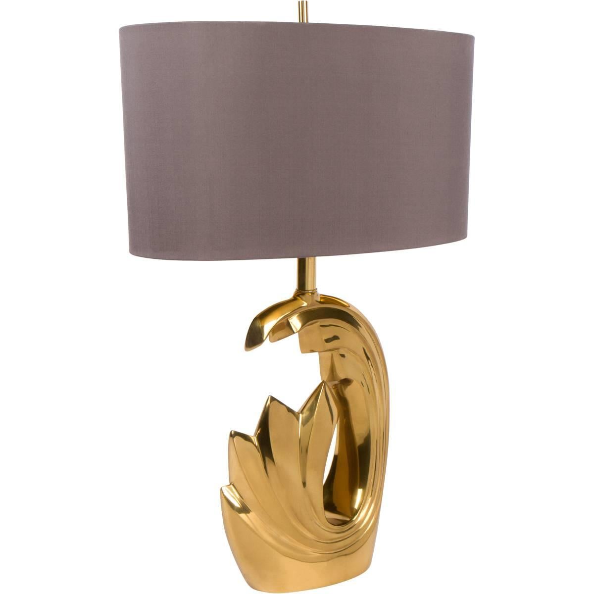 Chic brass lamp attributed to Pierre Cardin in the 1970s. Perfect size for a desk or console table. New custom gray silk shade.