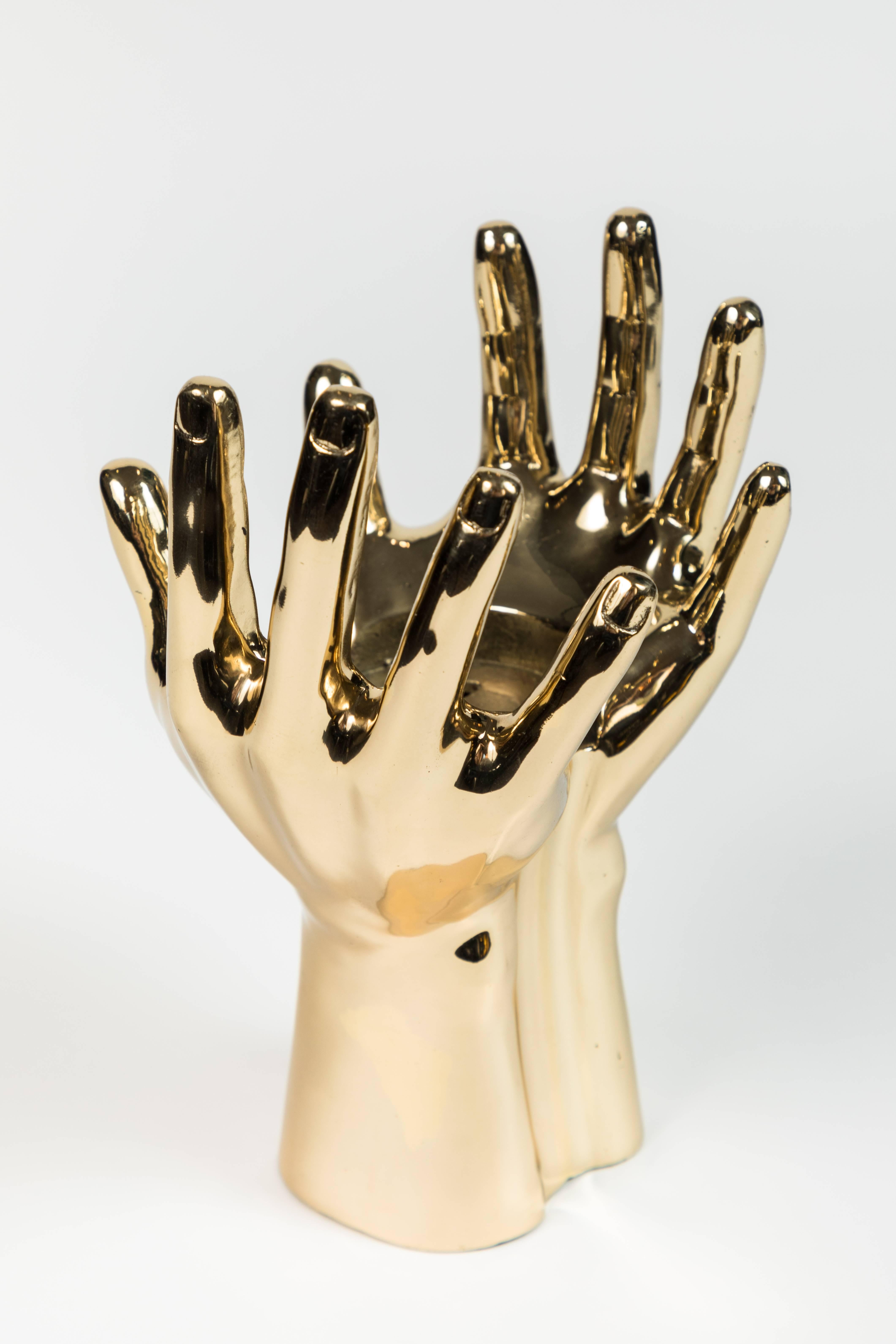 Sculptural brass hand in polished brass. French, 1970s. Hand has been drilled as this was previously a lamp. It could definitely be rewired and used as a lamp, but we like it as a purely decorative object.