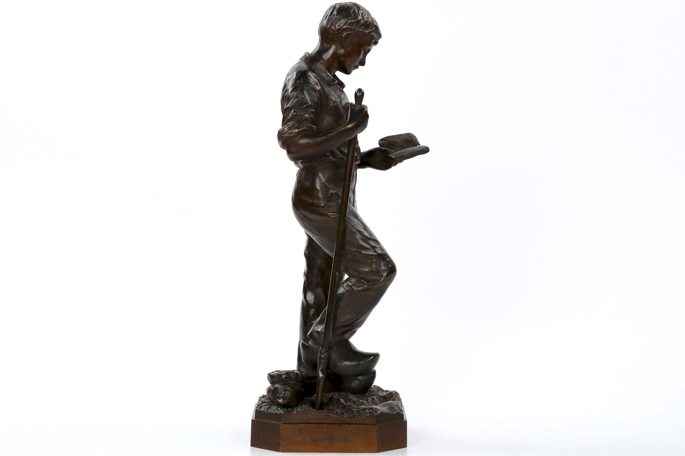 Patinated French Bronze Sculpture of Laborer Studying by Hippolyte Peyrol