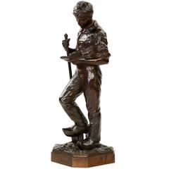 French Bronze Sculpture of Laborer Studying by Hippolyte Peyrol