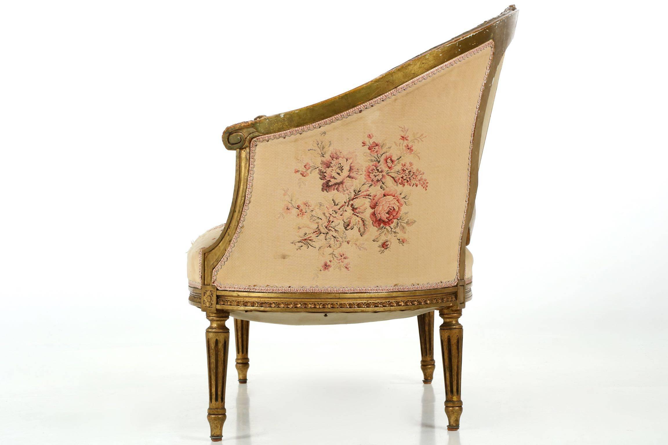 This gorgeous French Louis XVI style canapé was crafted during the last quarter of the 19th century, the surfaces are carved in the typical manner of the period with highly detailed ribbon work along the crest among foliage, the frame a repeating