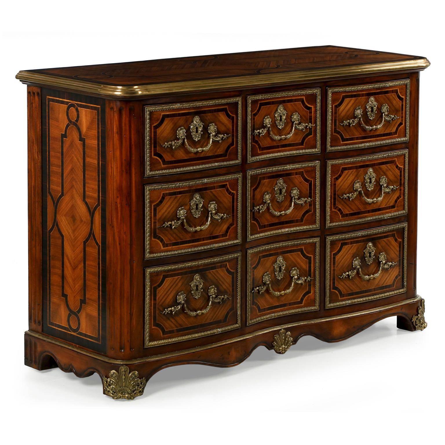 This very fine reproduction after the original in Althorp was designed by Theodore Alexander in the Althorp Living Home collection and is called “the Commodious Chest”. An exquisitely crafted work, the marquetry throughout is of the highest quality,
