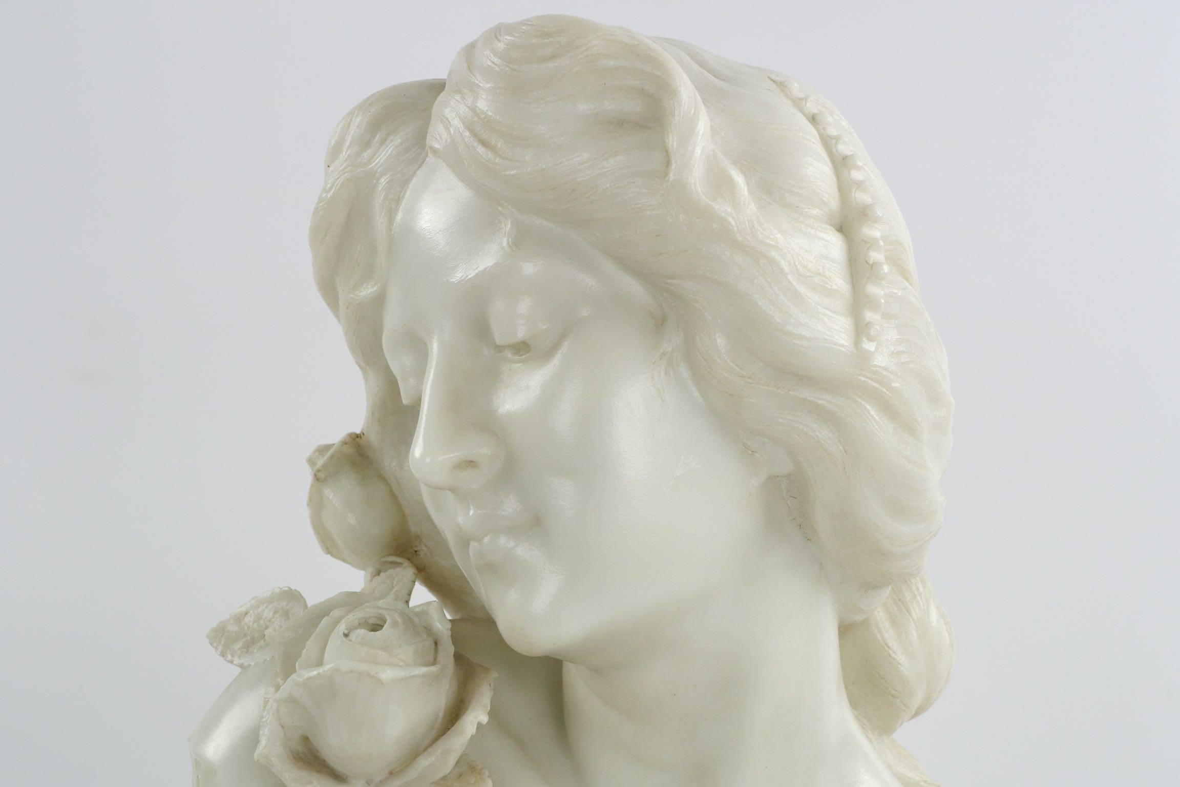 A very finely carved sculpture of a young woman in spring, the surface is detailed with incredible clarity and precision. Her hair is perfect in it’s complex styling, much of the individual hair strands incised as they fall over her bare shoulders.