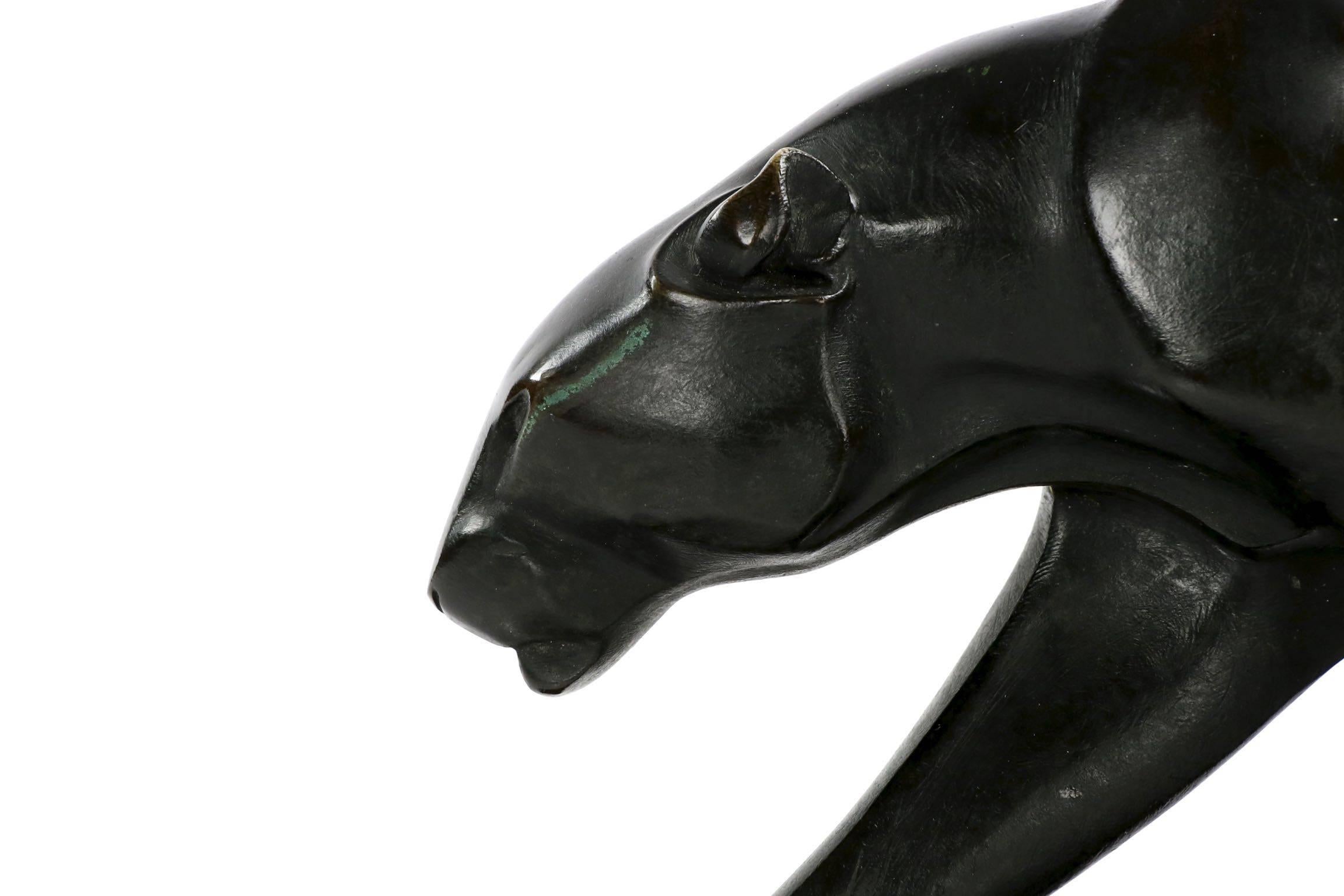 A powerful and sleek model of a black panther walking, this work captures the Art Deco movement with its mechanized minimalism and proportions while in every way representing the spirit of the Animalier school. A trained animalier, Maurice Prost was