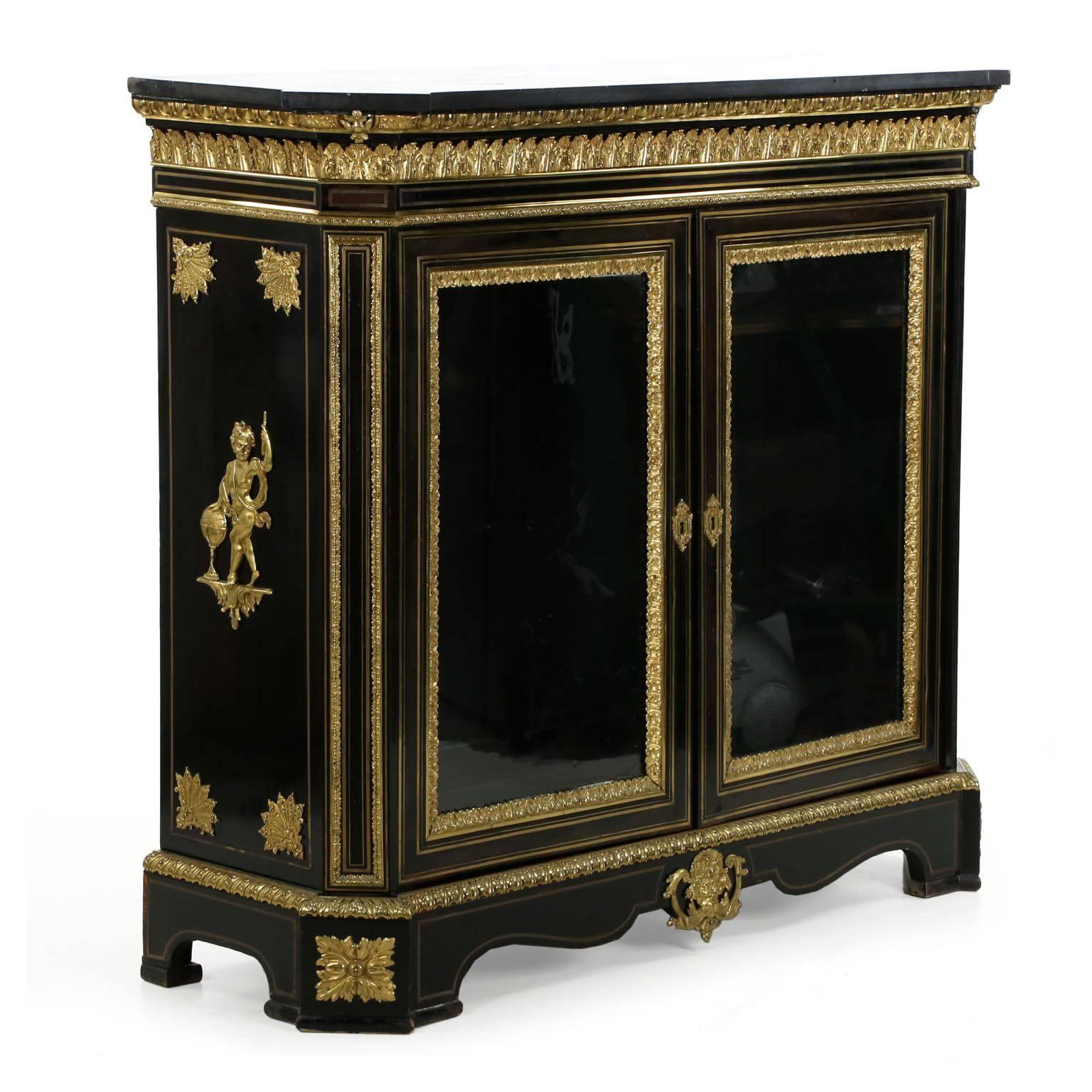 This exceptional cabinet is preserved in truly remarkable condition, where ebonized surfaces will generally fade rather unattractively and brass work tends to dislodge from shrinking and moisture, this piece has remained relatively untouched by the
