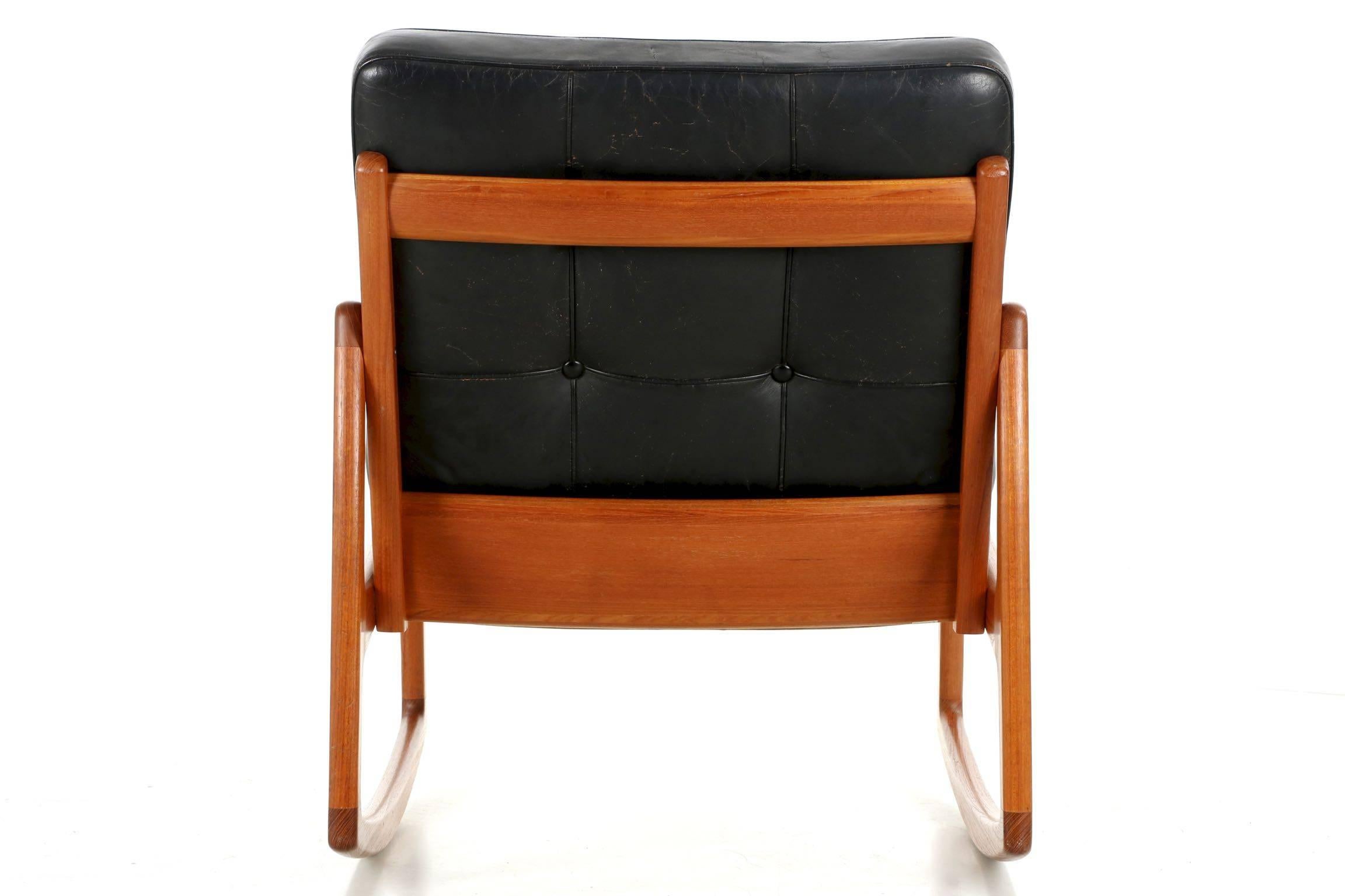 Mid-Century Modern Danish Modern Sculpted Teak and Leather Rocking Chair by Ole Wanscher