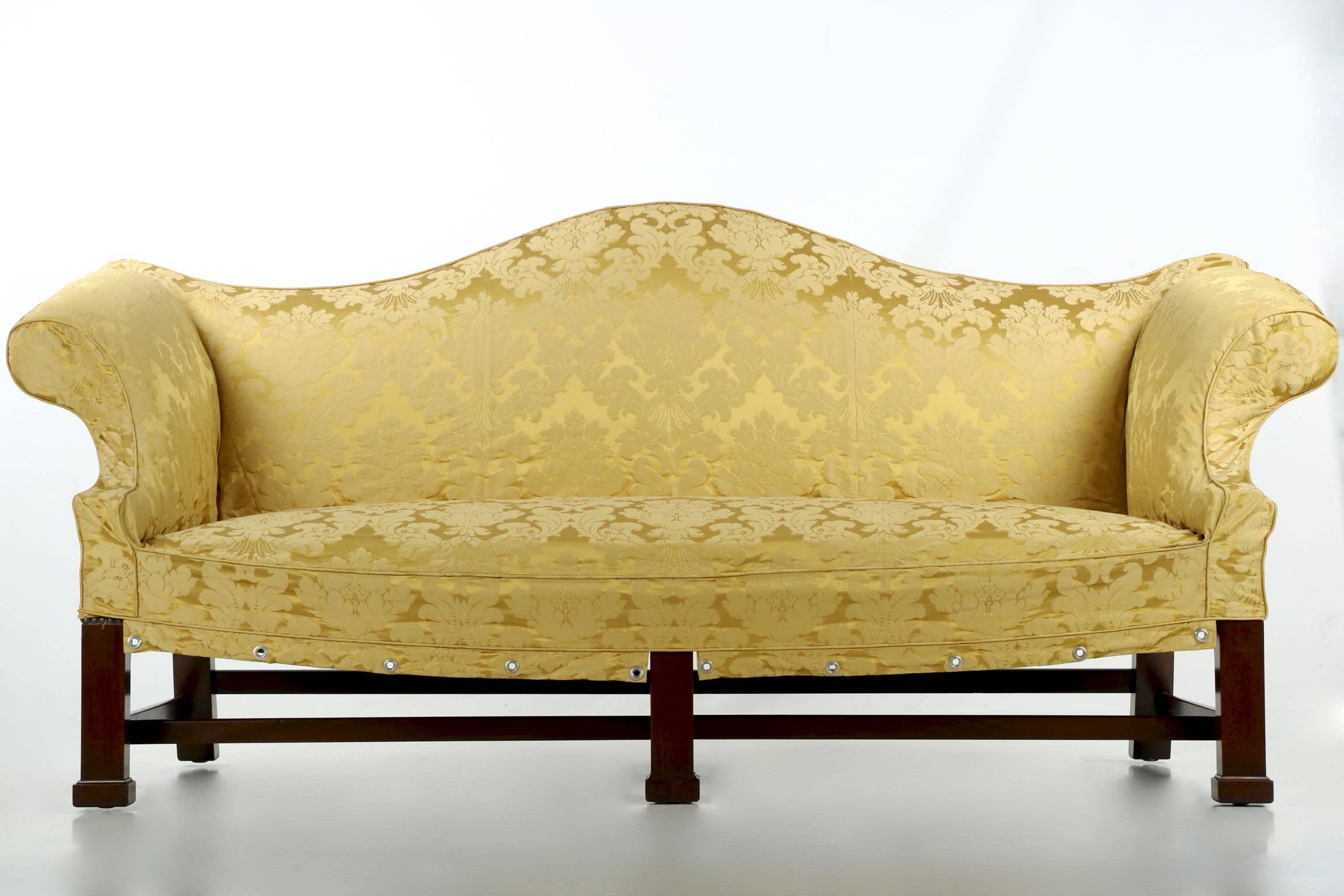 Clearly influenced by the Thomas Affleck sofa currently held in the collection of the Department of State in the Diplomatic Reception rooms, this fine reproduction is powerful and impactful from every angle. Most attractive are the thick mahogany