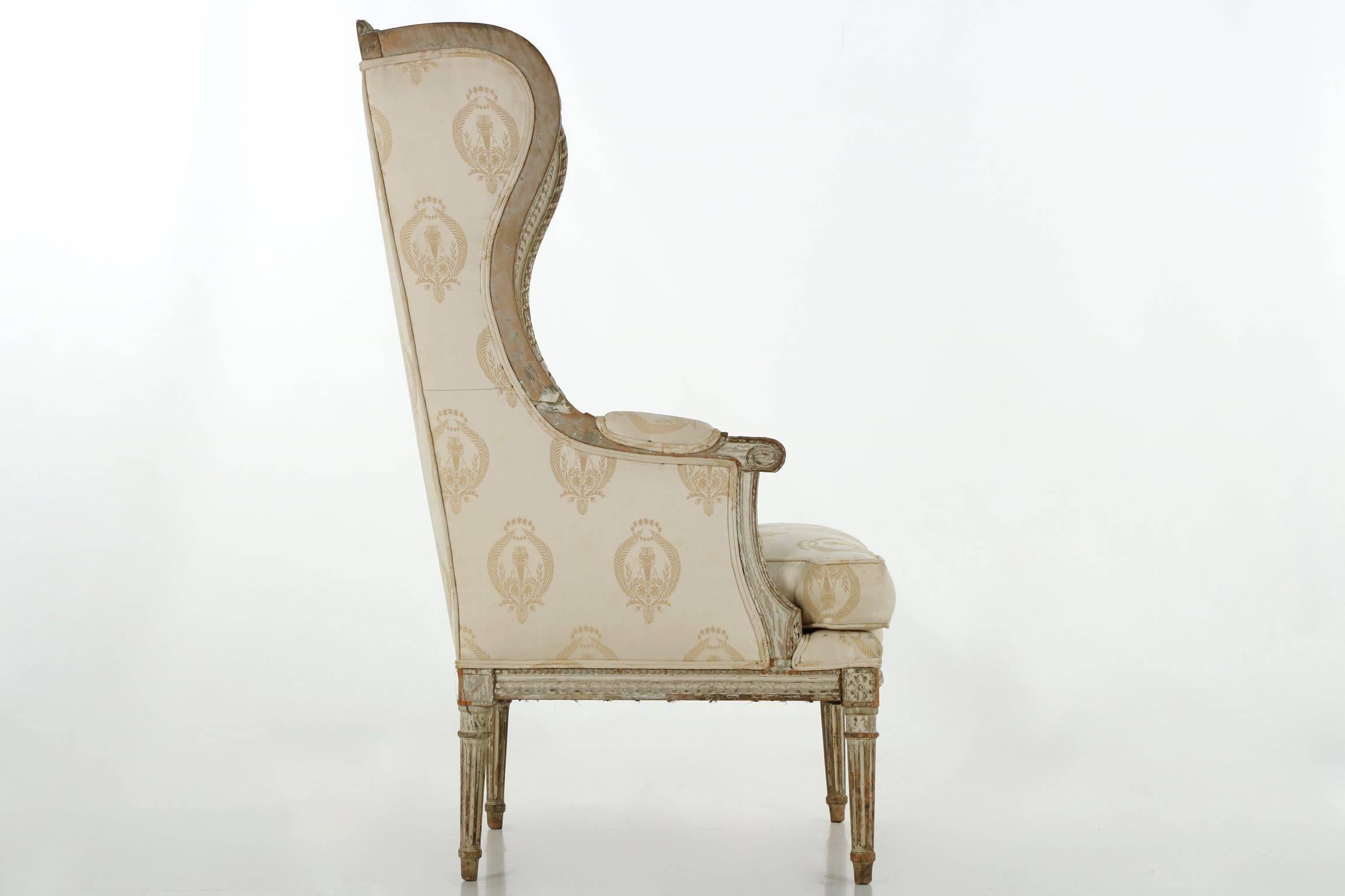 Hand-Carved French Louis XVI Distressed Painted Antique Wingback Armchair, 19th Century
