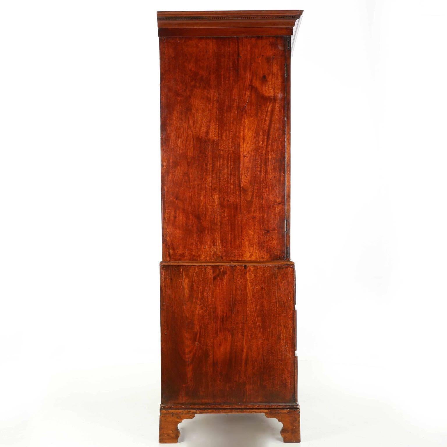 English George III mahogany linen press,
circa 1780, with gorgeous early patina.
    

A silky and beautifully developed early surface patina allows the dense island mahogany utilized throughout the case to simply glow beneath a projecting