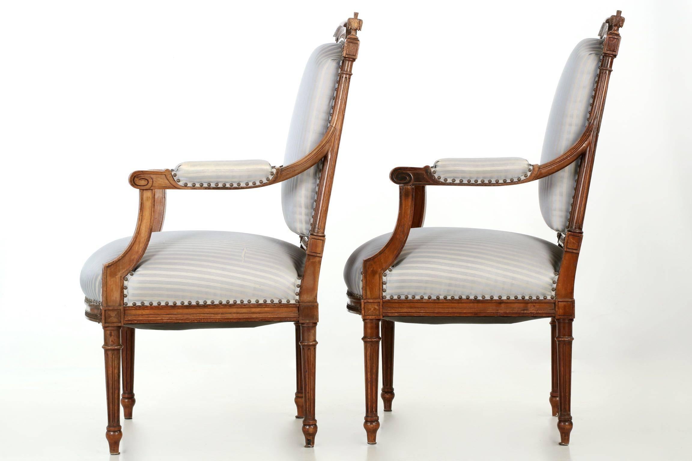 European Pair of French Louis XVI Style Carved Walnut Antique Armchairs