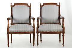 Pair of French Louis XVI Style Carved Walnut Antique Armchairs