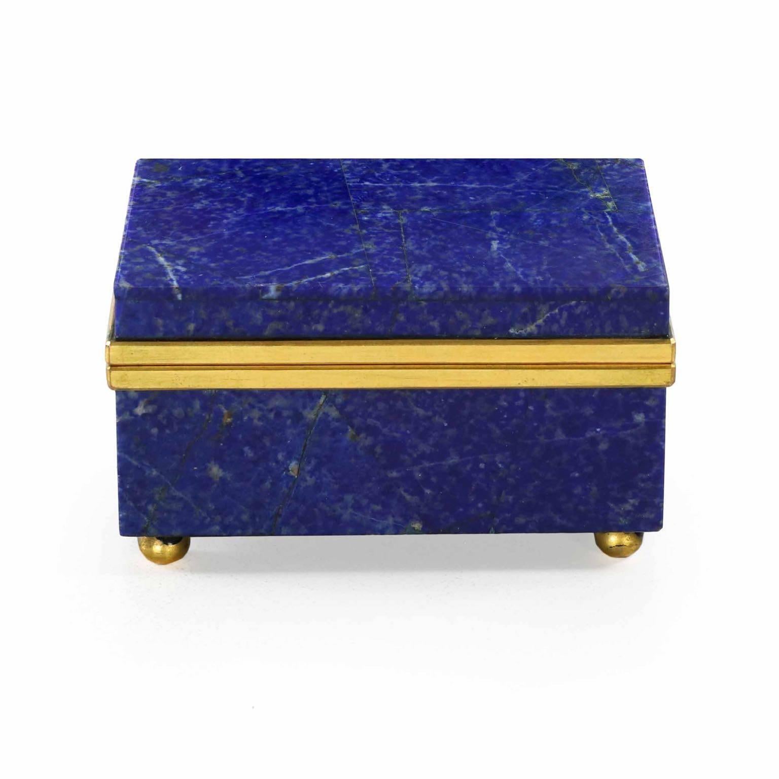 This rare and simply exquisite miniature jewelry box is so rich in surface. Veneered in the exotic Lapis Lazuli stone, the workmanship is beyond excellent - crisp seams and perfect finishing characterize all primary surfaces, the lid opening on
