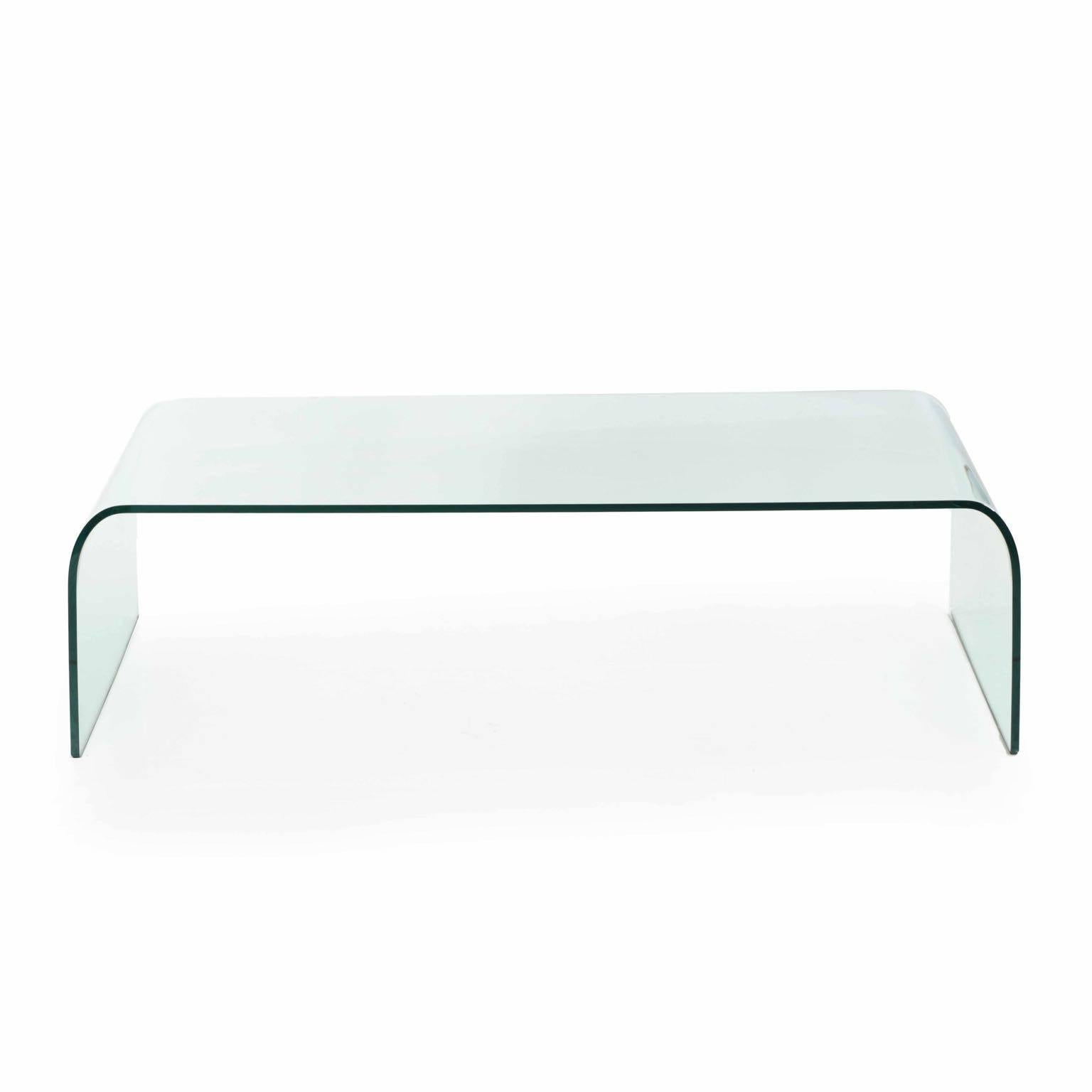 
This high quality tempered glass waterfall table was designed by Angelo Cortesi and manufactured by Fiam Italia along with a large series of other bent glass tables and consoles. The present example retains it’s original frosted label along the