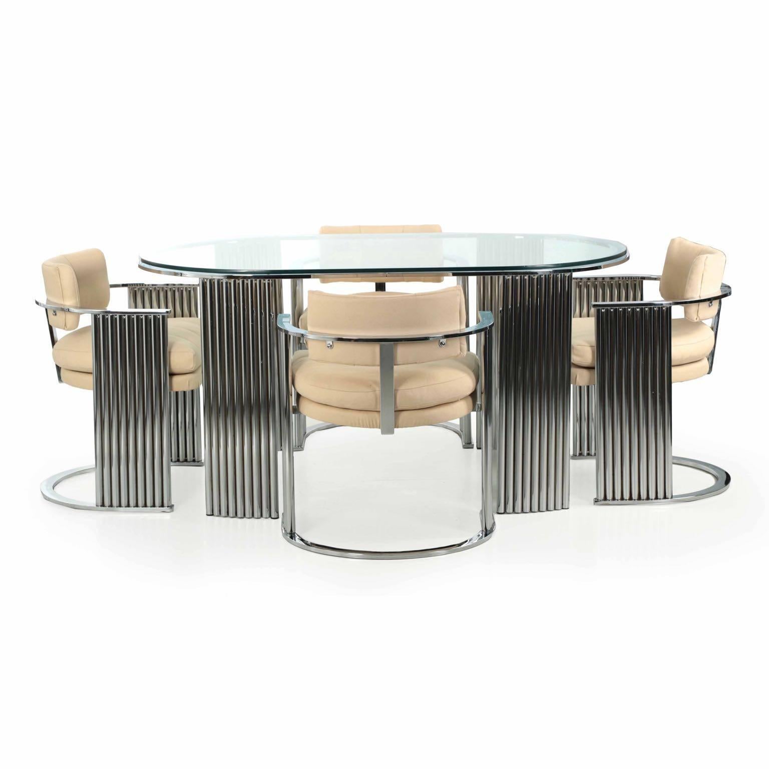 A rare and unusual dining set designed by Milo Baughman and manufactured by Thayer Coggin in High Point, NC during the third quarter of the 20th century, the form is closely reminiscent of the Art Deco period. High quality chromed steel shines