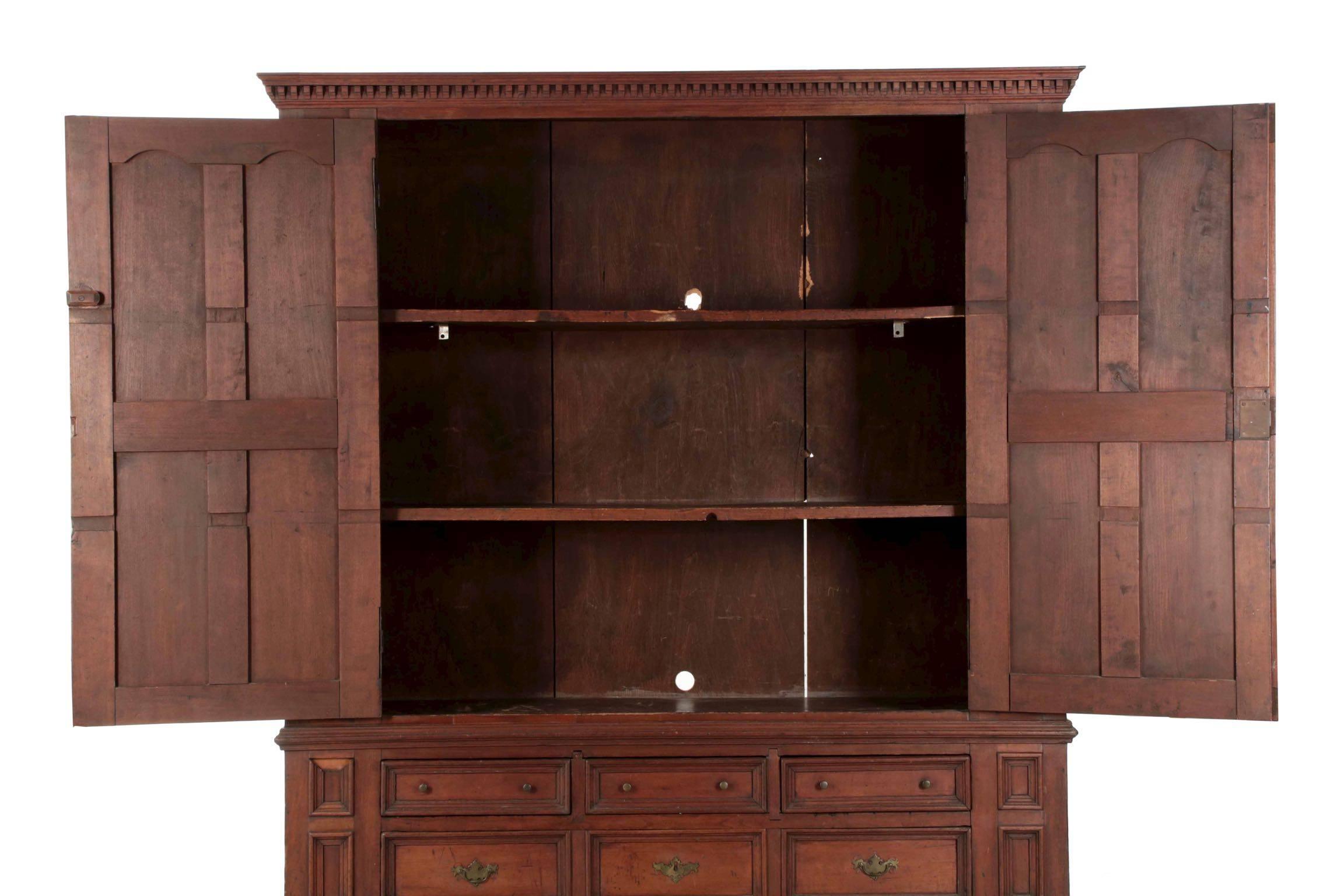 A powerful architectural object, this Fine shrank with tombstone door panels was crafted of solid cherry primary woods, probably in Pennsylvania during the last quarter of the 18th century. The piece is built as a single unit, not breaking down or