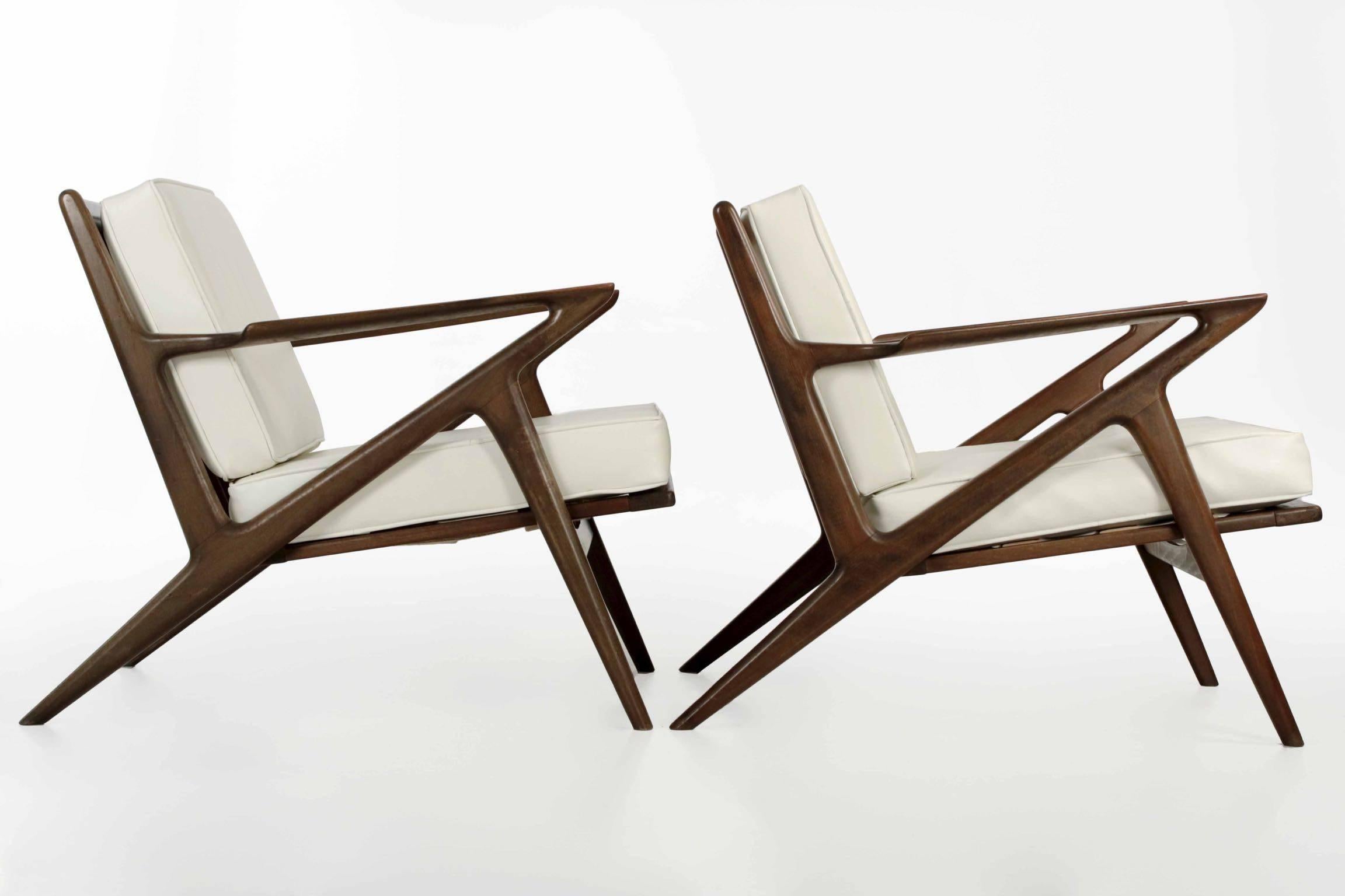 This gorgeous pair of vintage sculpted teak “Z” lounge chairs were designed by Poul Jensen in the 1950s, manufactured and finished by Selig in Massachusetts and retaining the original seals on the chairs with the Selig upholstery tags on the