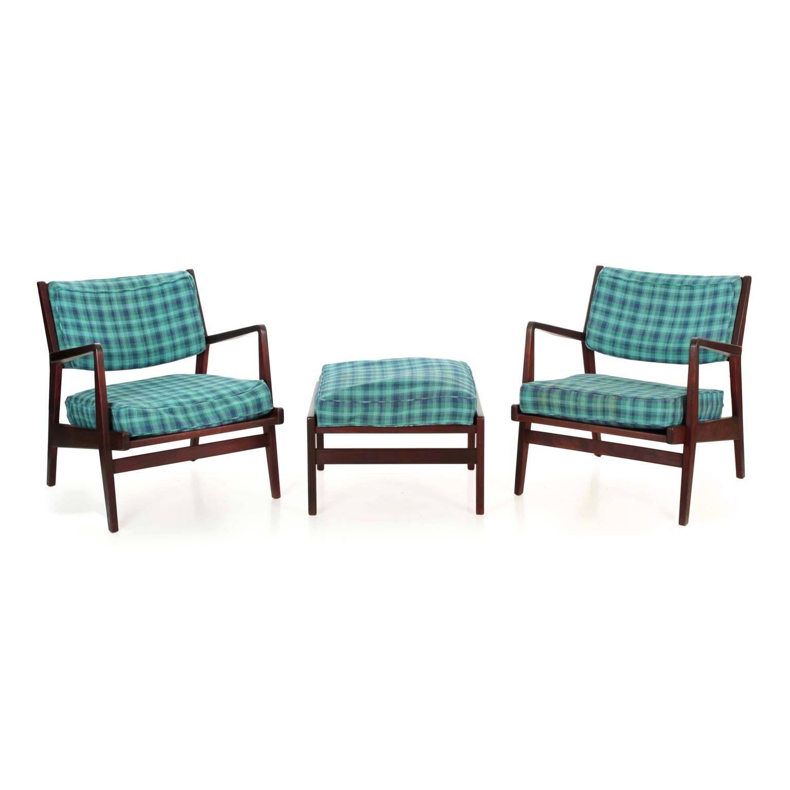 Pair of Jens Risom walnut U4230 armchairs with ottoman
Retaining original labels under cushion, circa 1960s

This gorgeous pair of model U4230 armchairs and matched ottoman were designed by Jens Risom for Jens Risom Design and retain their