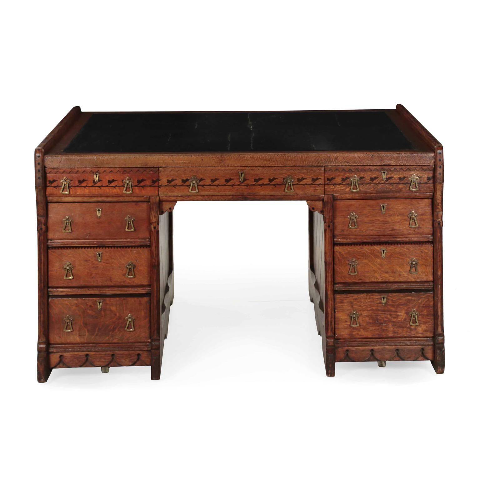 A beautifully crafted desk that embodies the concept of the “Partners Desk”, it is inordinately large and spacious with a full retinue of drawers on either side accompanied by a broad clean working surface finished in Greek-key embossed leather. The
