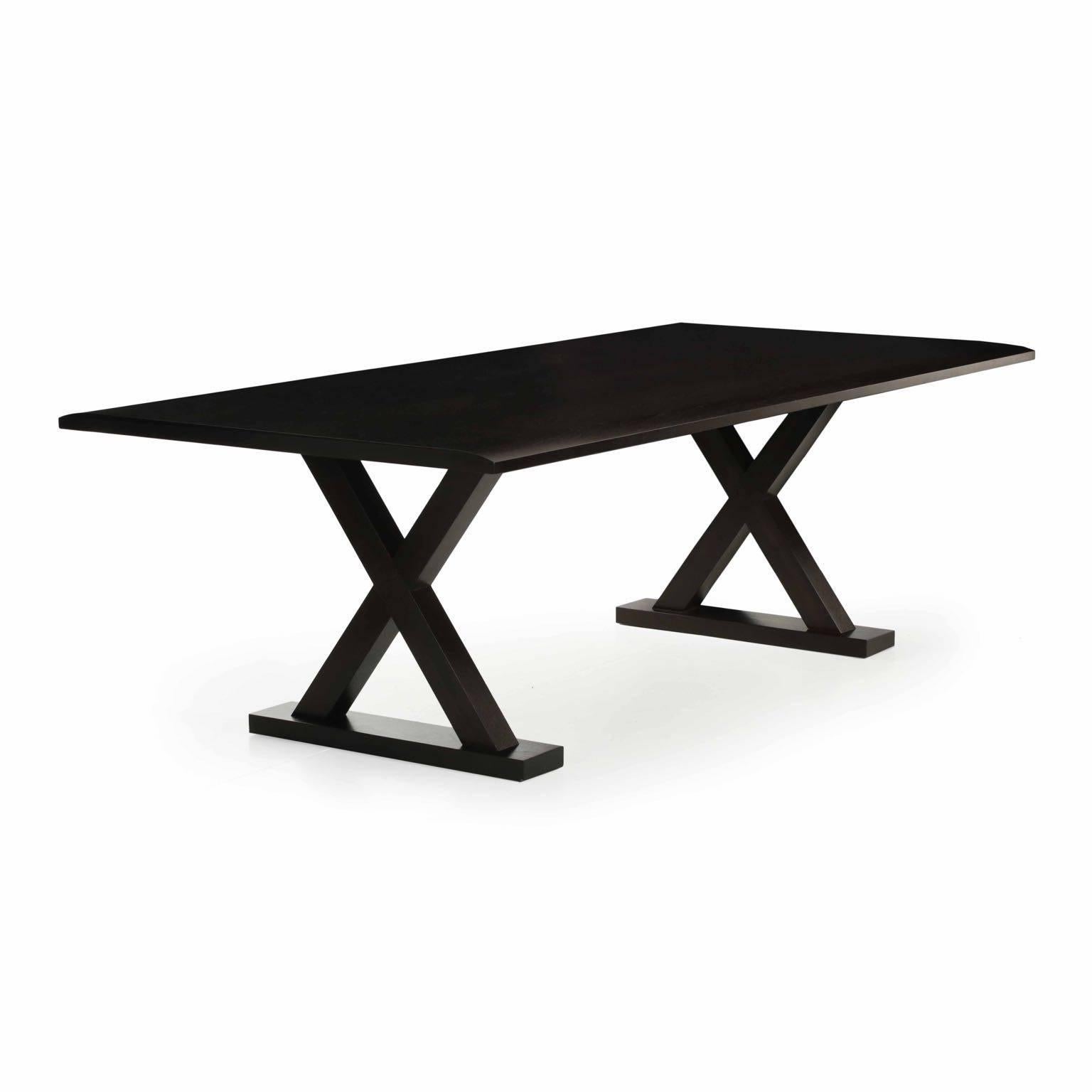 A striking modern dining table designed by Christian Liaigri, it was clearly cared for and remains in overall wonderful condition. The vivid grain of the wood is softened by the dark oiled surface while the edges of the table curve beautifully to