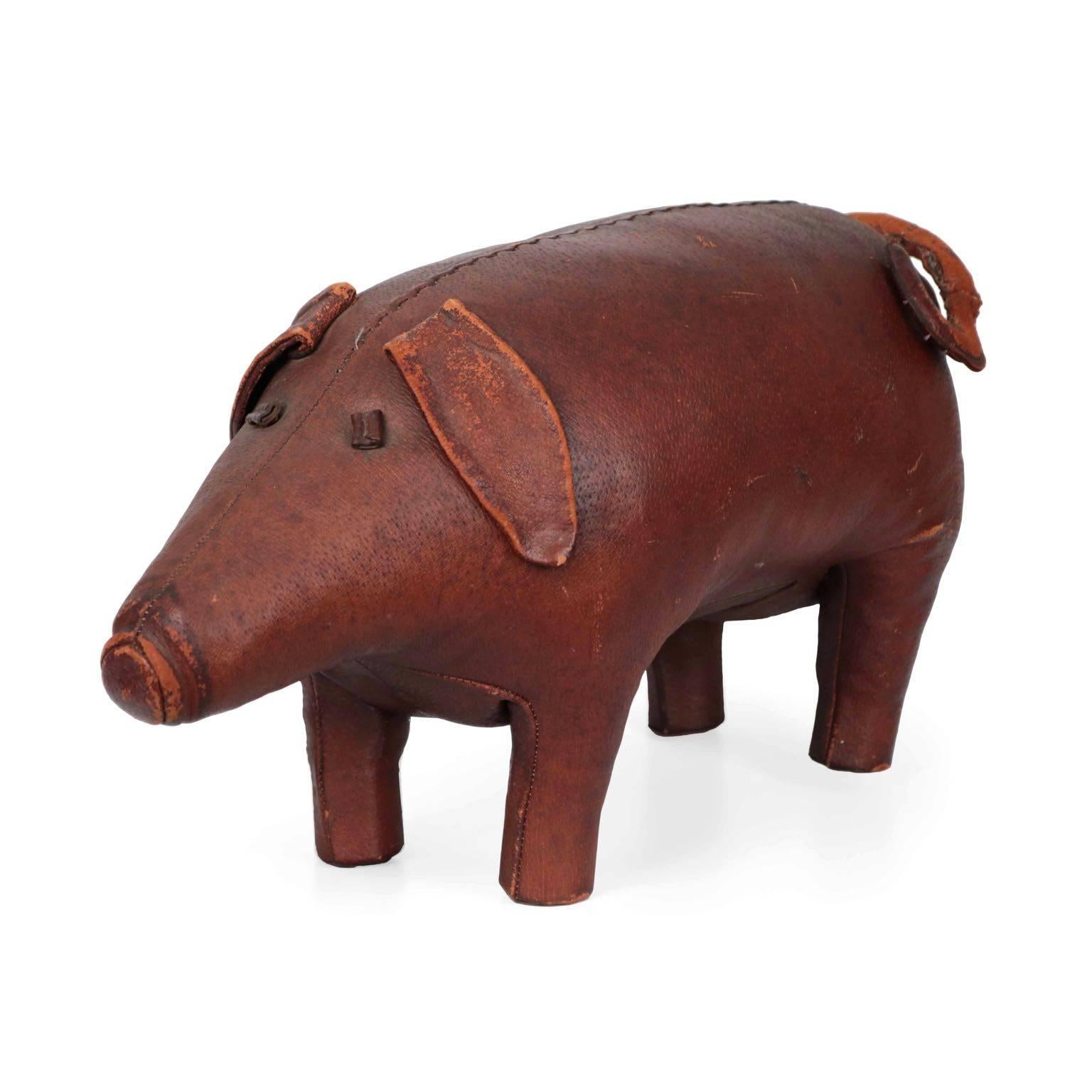 An early example of the animal footstools designed by Dimitri Omersa of Liberty and retailed by Abercrombie & Fitch in the United States, the pig was the first design of the company. It is entirely stitched and fabricated by hand with beautifully