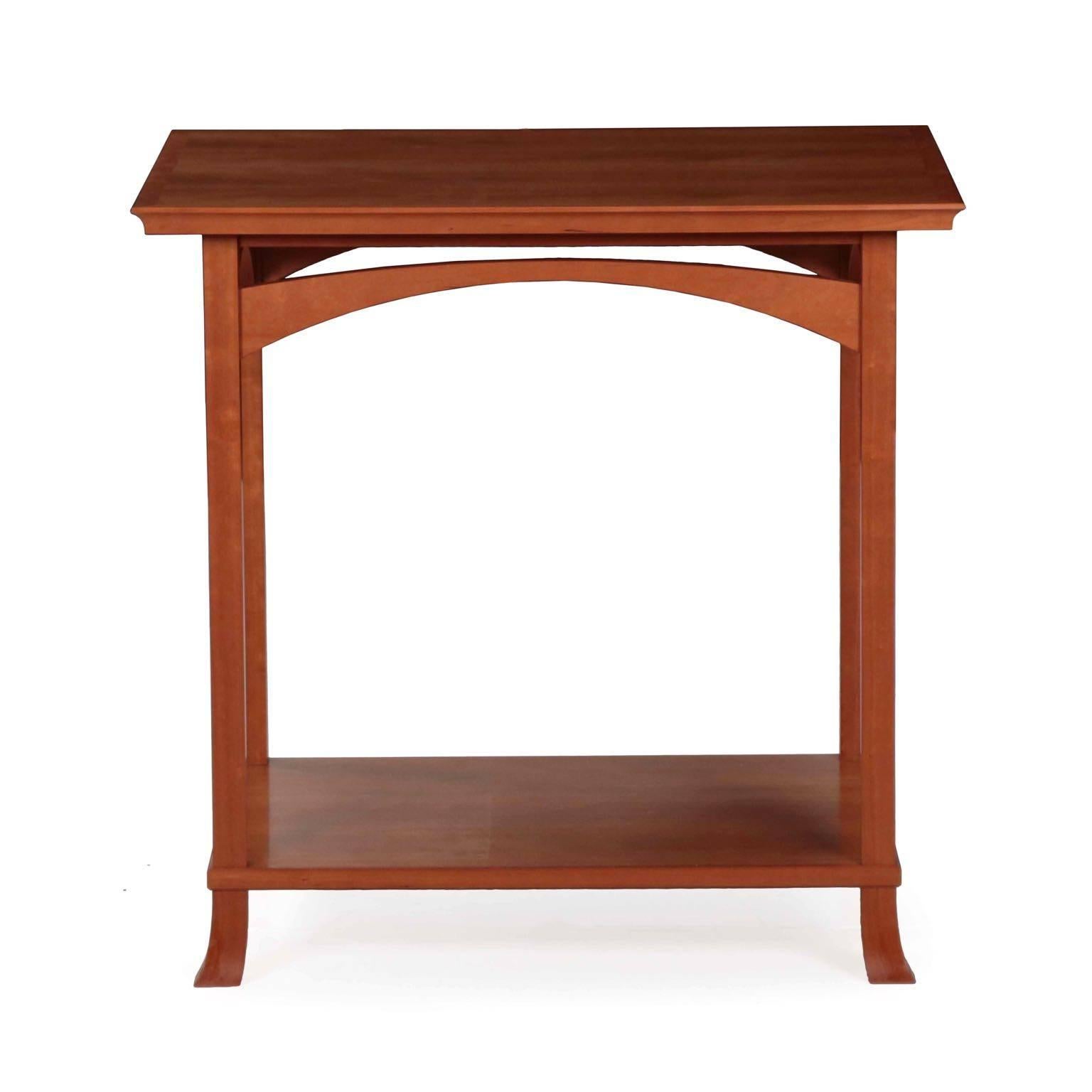 This is a very fine custom designed cherrywood side table by Newport Design Studio in Rhode Island; the signature of the actual craftsman executing it is somewhat illegibly scrolled to the underside of the top and dated ’98. We have copies of the