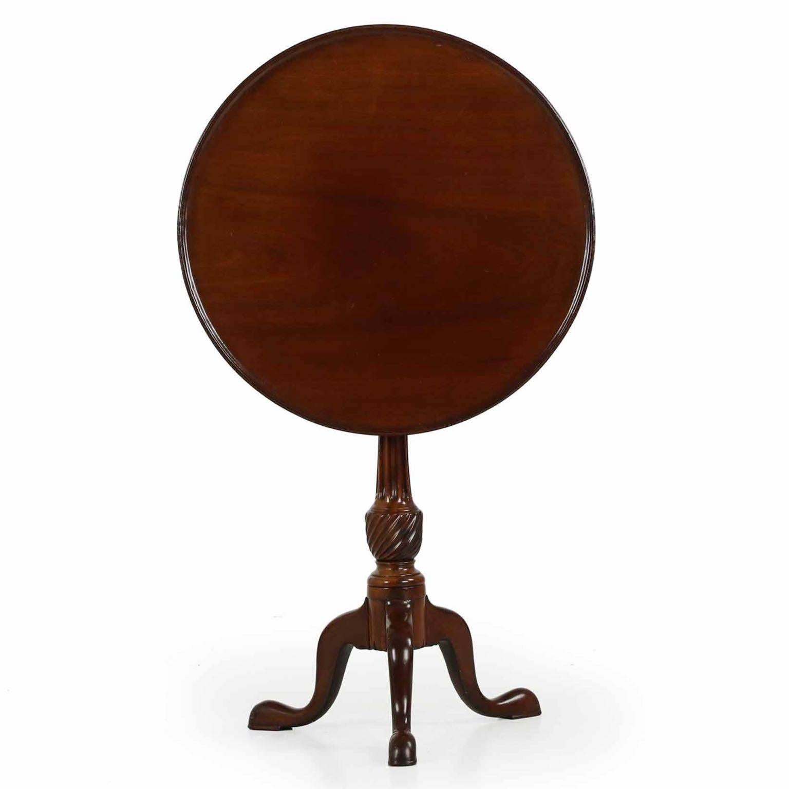 A most refined and perfectly balanced tripod leg tea table of the George III period, the craftsman for this piece chose the finest timbers for it’s execution. The circular top is carved out of one solid, thick slab of mahogany. It was turned on a