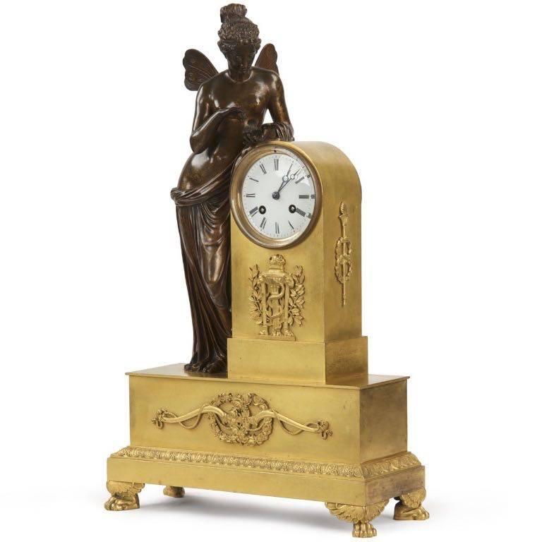 This impressive timepiece centers around the figural of Psyche, her finely detailed wings fluttering behind her as she remains transfixed on the butterfly resting in her open palm. The casting quality is impeccable, her hair an intense display of