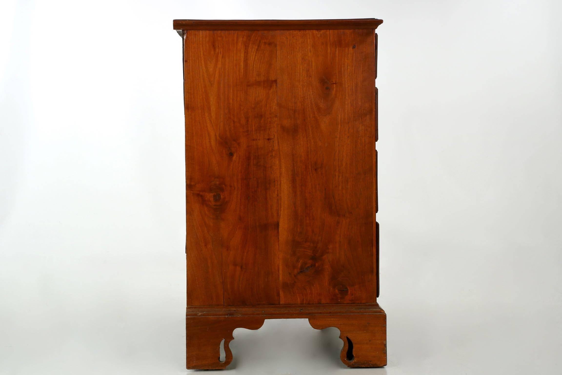 A rare and unusual chest, it is simple in construction and appeal, set apart by it's highly interesting pierced bracket feet. The feet are complex, the outer edges an ogival form interrupted by a series of fillets; the last stretch of the foot is