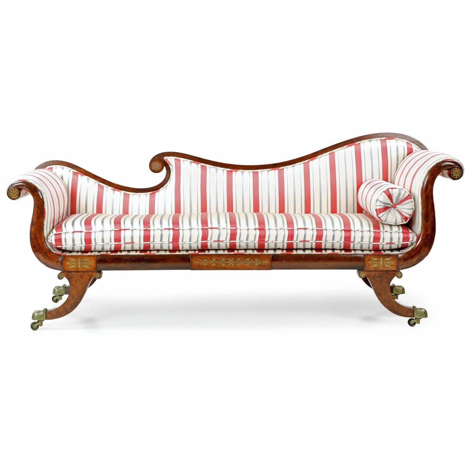 With an elegant curvature borrowed directly from the classical Greek designs so highly sought after during the first quarter of the 19th Century, this exquisite recamier is of superb quality with very fine craftsmanship throughout.  The dense and