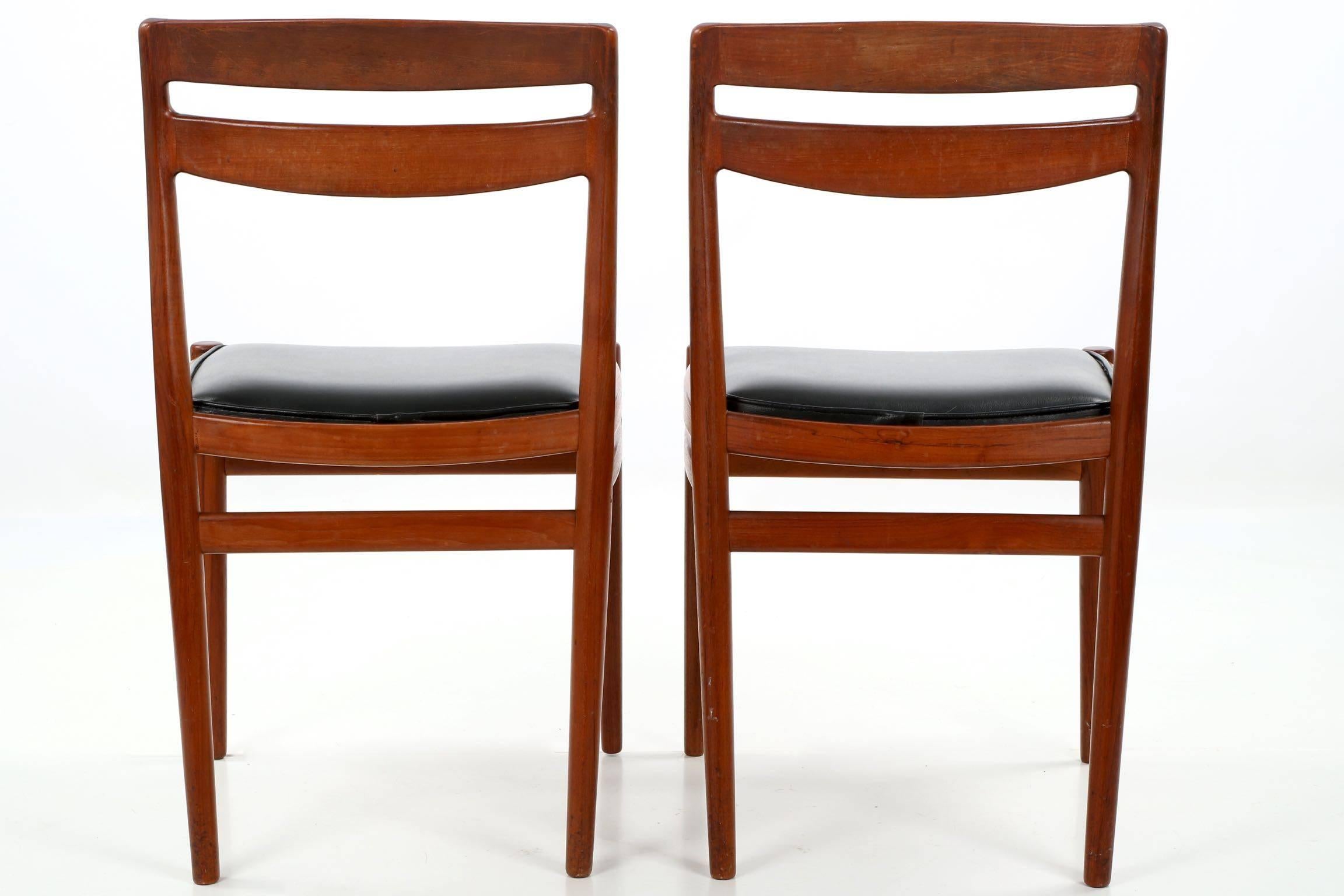 Faux Leather Four Danish Mid-Century Modern Teakwood Side Chairs, Retailed by Leo Spivak Inc.
