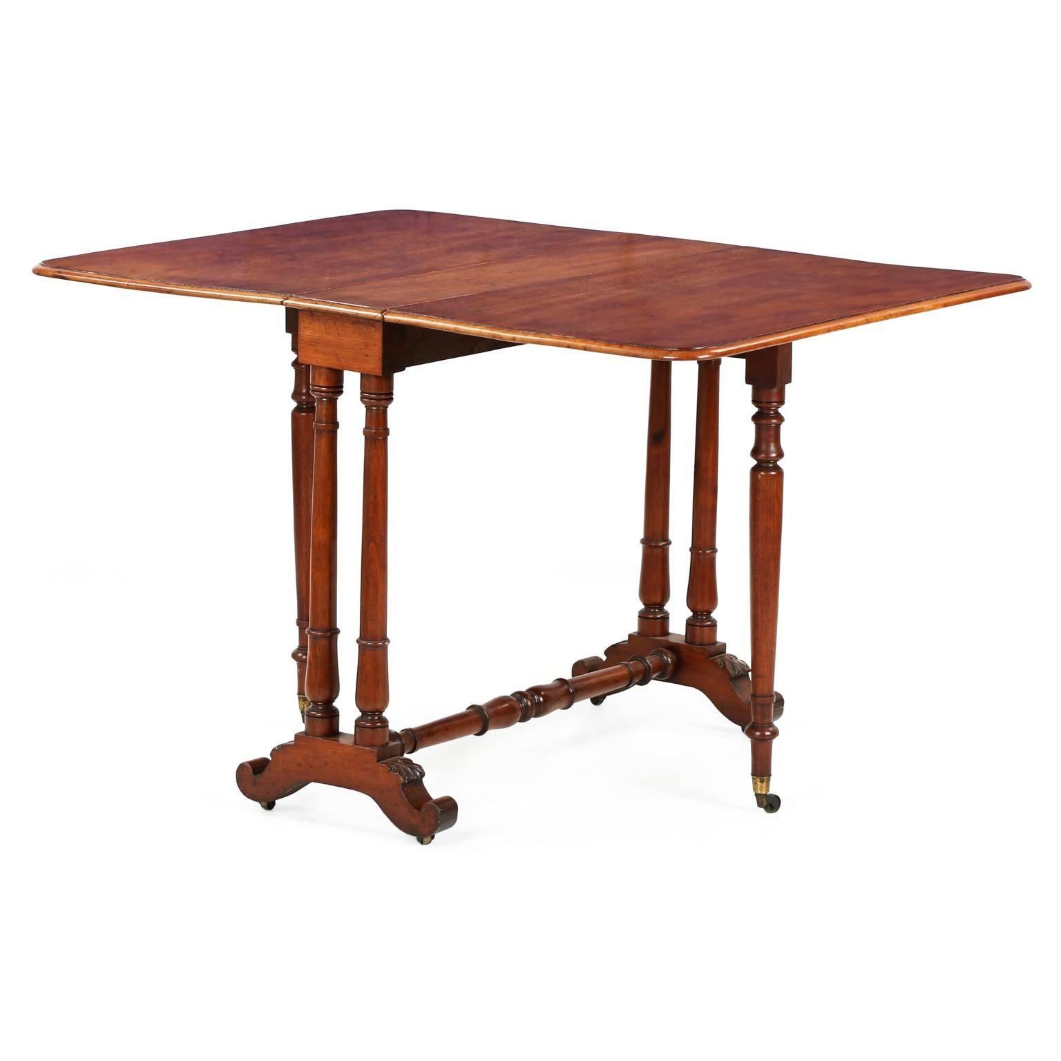 This beautiful drop leaf table is a form unique to the late Regency period in England known as a “Sunderland” table. Particularly petite in footprint, the table reduces to being only 14” in depth when folded along a wall, the gorgeous large planks