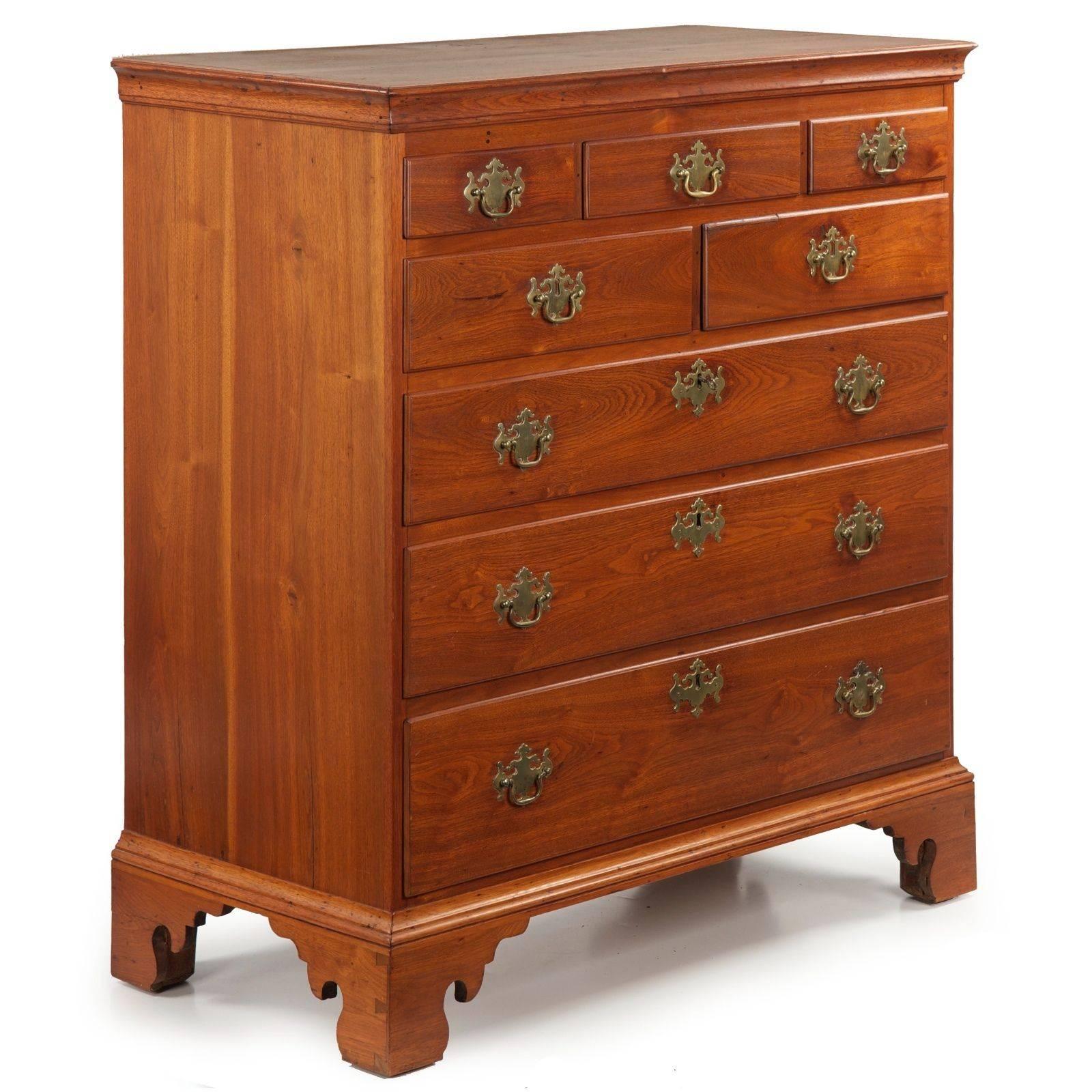 A very attractive piece executed in solid walnut, this delightful chest of drawers was crafted during the last years of the 18th Century in Pennsylvania.  The bold crown molding surrounding the finished walnut top projects over a tidy facade of