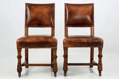 Pair of English Antique Leather and Carved Oak Side Chairs, circa 1900