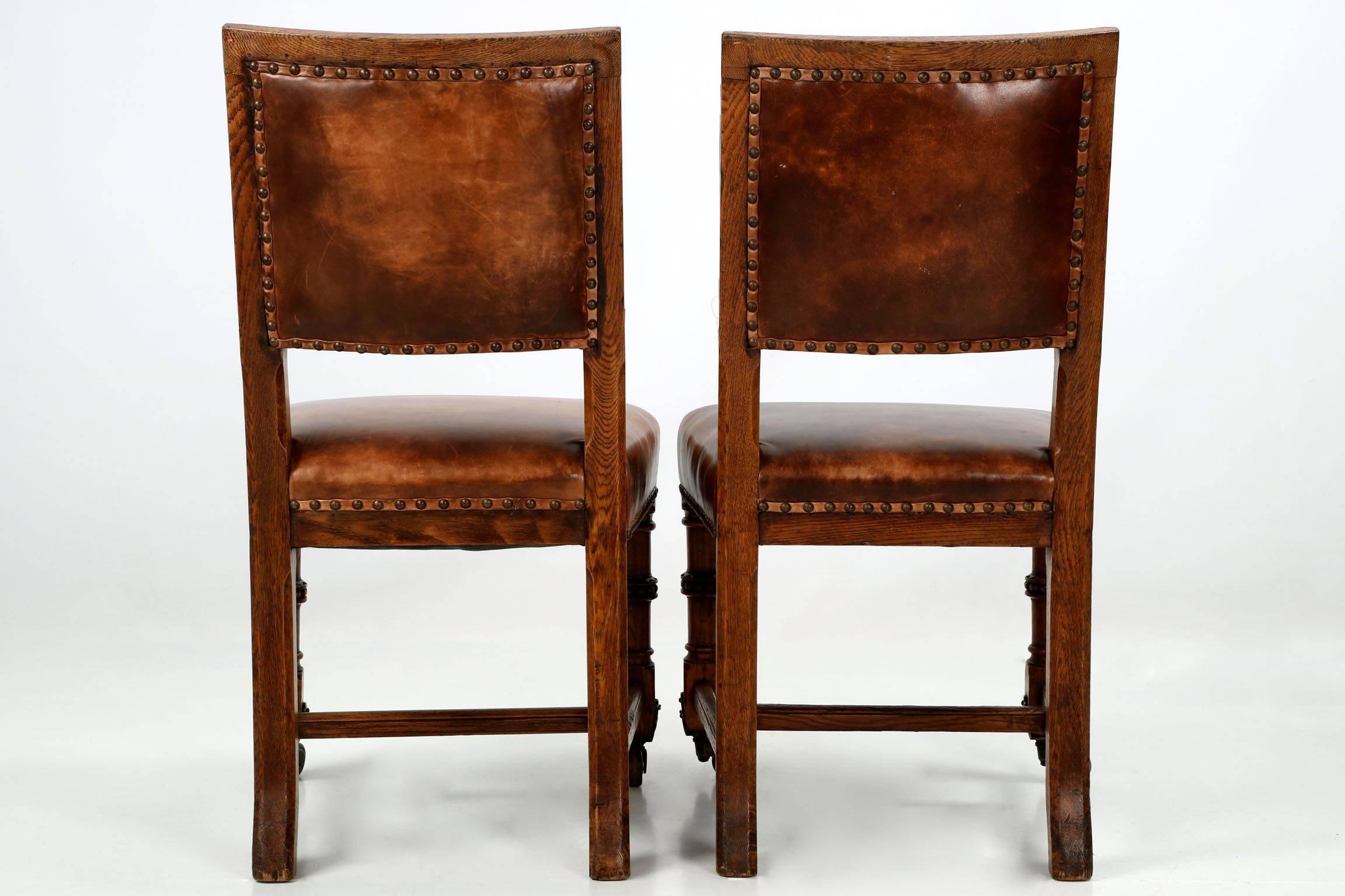British Pair of English Antique Leather and Carved Oak Side Chairs, circa 1900