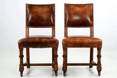 Pair of Patinated Leather and Carved Oak Side Chairs, England, circa 1900