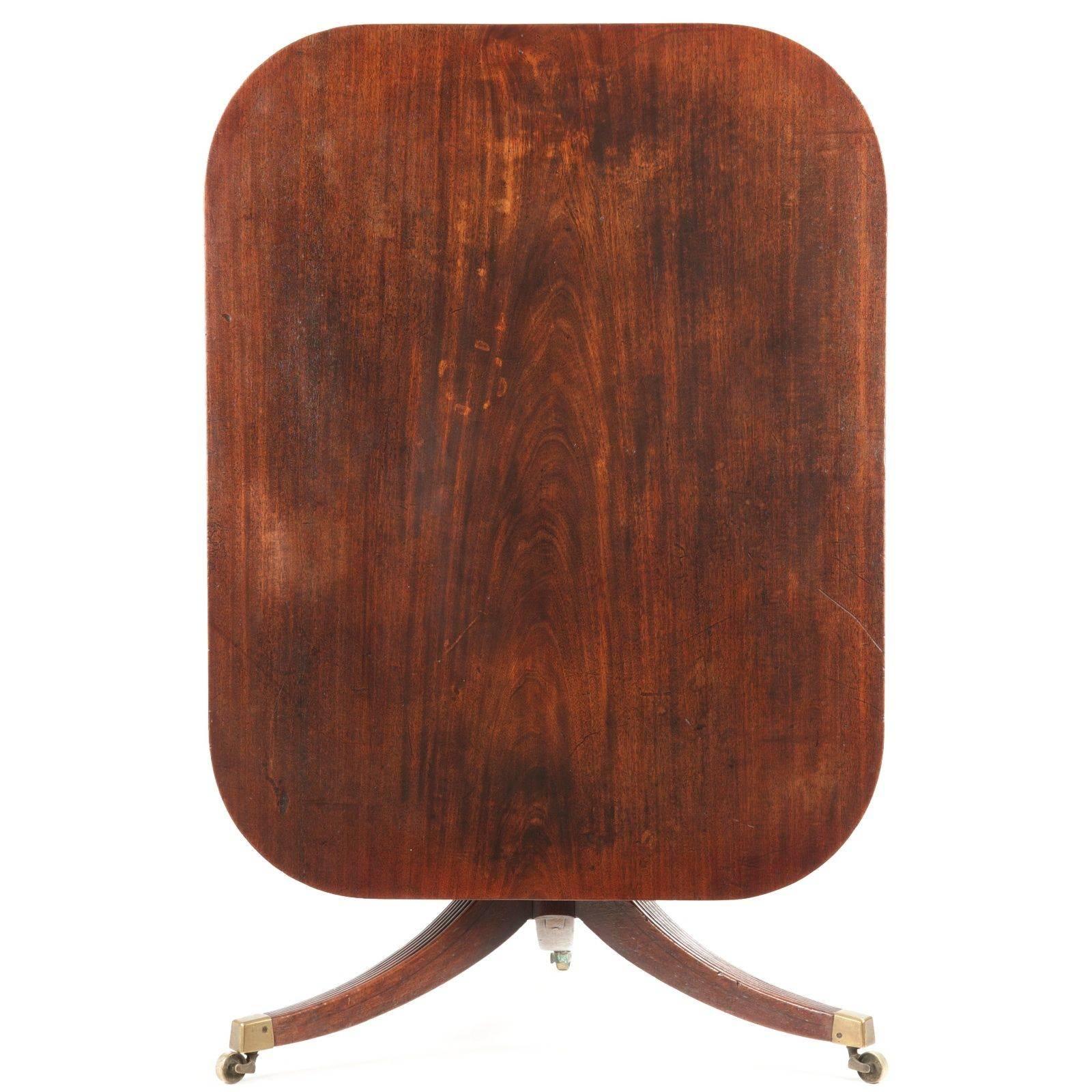 This fine antique breakfast table features a wonderful well patinated dark mahogany surface under many layers of later wax, the mellow hues very attractive on the solid mahogany top. An old and dense tree was used for this table top, the whole
