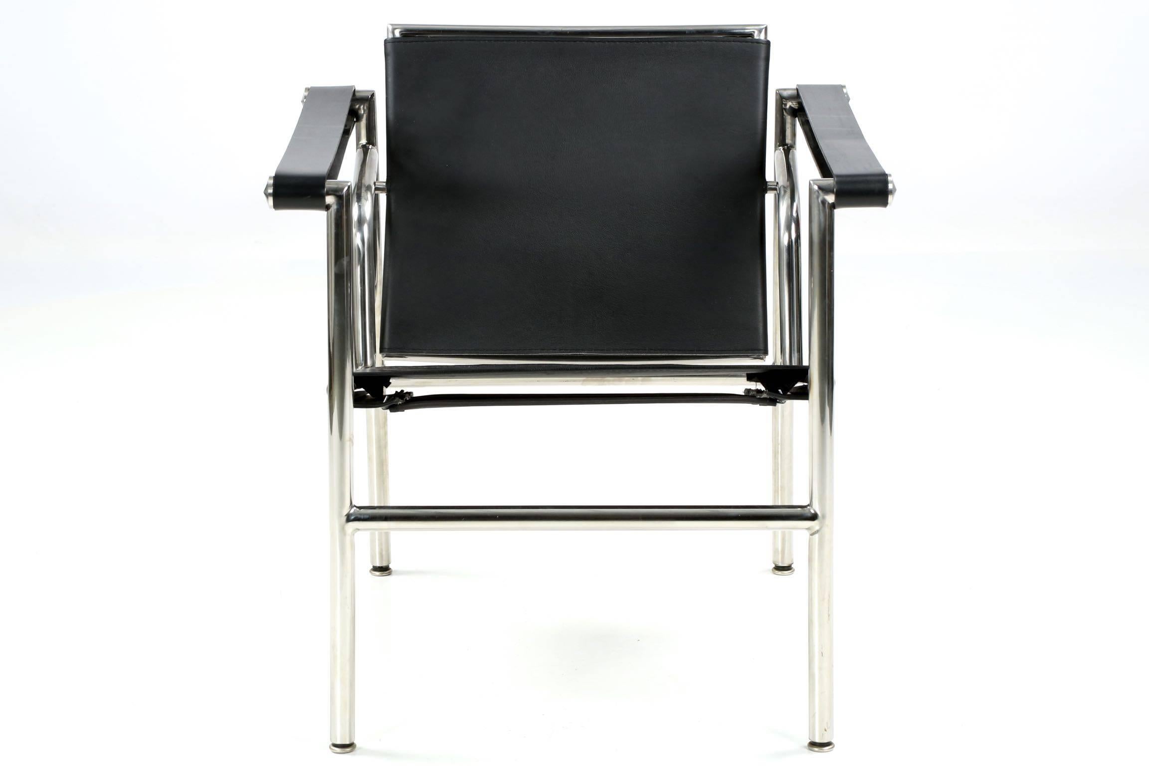 A finely crafted chromed steel tubular arm chair, probably crafted in the last decade as an exact model of the LC1 Basculant. A very high quality reproduction, the saddle leather is thick and expertly stitched with very high grade hardware and