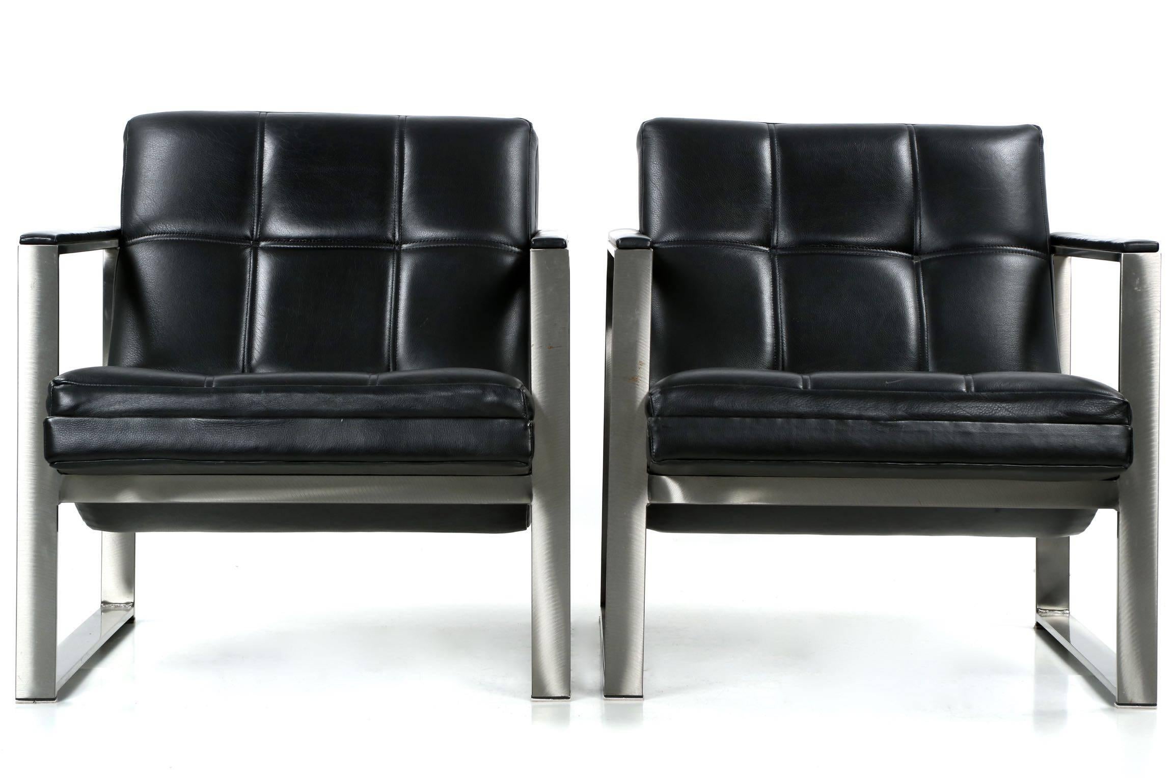 An angular pair of late 20th century sculpted lounge chairs, both retain their original labels from Villency Pure Designs. The brushed steel structure is inordinately heavy and well crafted, the lacquered steel in quite excellent condition with only