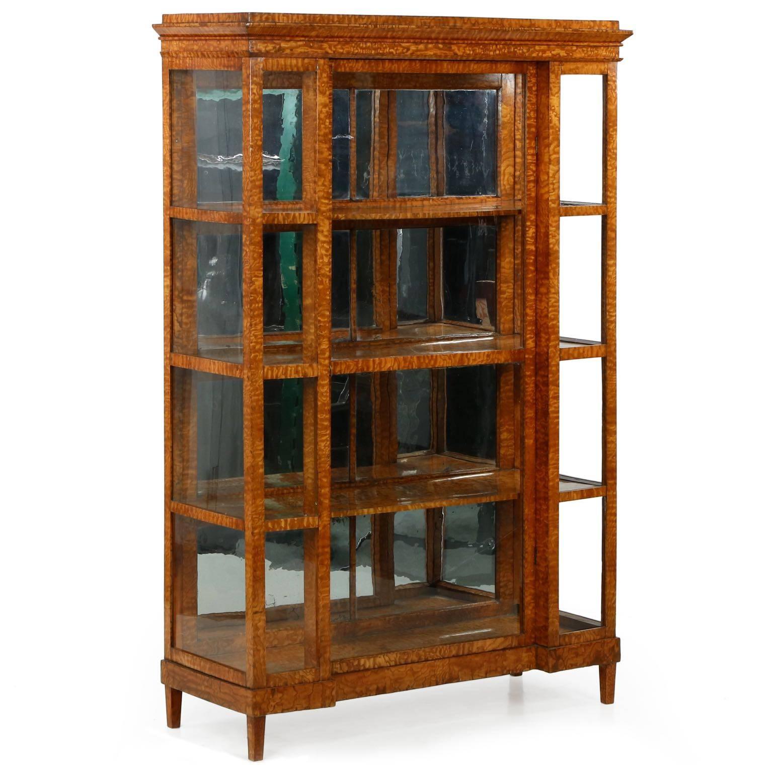 One of the most visually intriguing cabinets we’ve carried in quite some time, this very fine Biedermeier vitrine is a testament to the incredible effect a chaotic grain can have in defining a design. A work that is austere in every sense, a squared