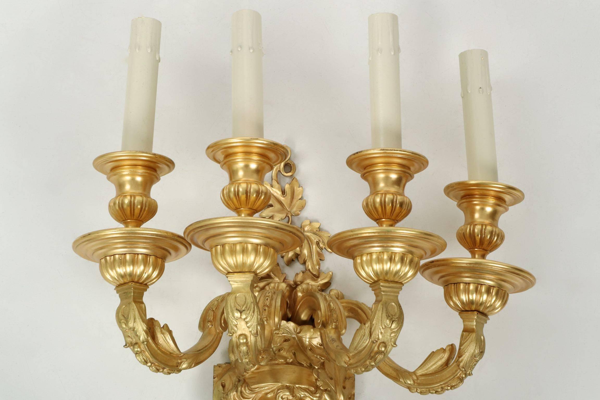 In every way exceeding expectations, this very fine pair of gilt bronze sconces is a testament to the fine casting skill developed on this side of the Atlantic during the 19th century. The firm of Mitchell, Vance & Co. was founded in 1845 and by
