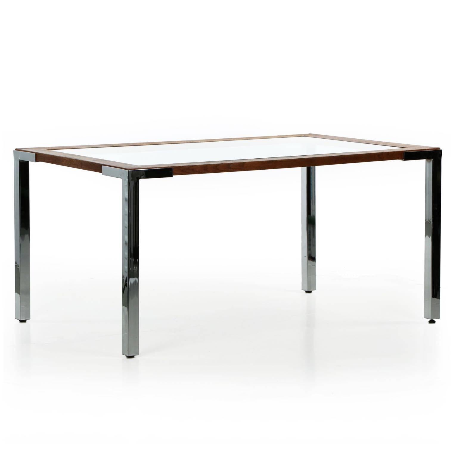 A most interesting minimalist dining table, the quality self-evident in the relentless lamination of oak using half-dovetail keys to lock the frame together. A thick glass pane drops into the recessed groove around the edge of the table; this raised