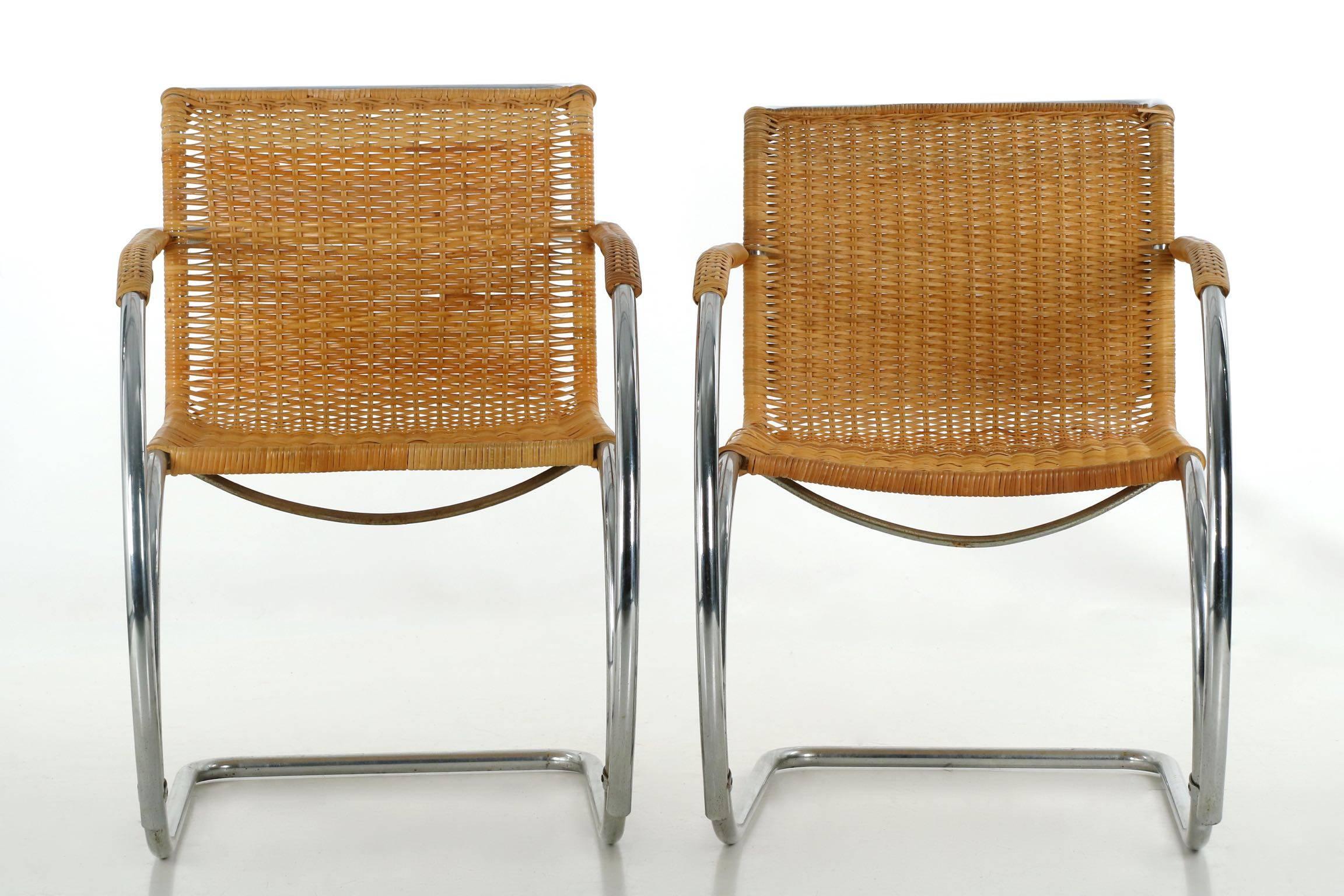 This striking pair of MR20 chairs by Mies van der Rohe were executed by Stendig in the 1960s, one chair still retaining the original paper label on the stretcher bar. Both retain their original caning with it’s worn patina, still absolutely