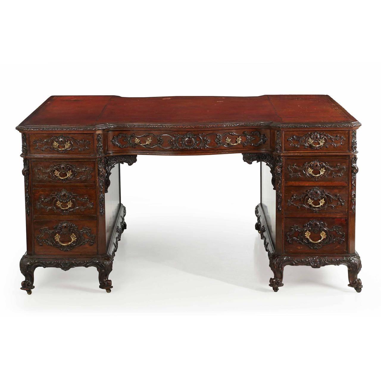 This inordinately fine partner’s desk was crafted by the firm of Bertram & Sons in London in the last quarter of the 19th century. William Bertram established his firm in 1830 and began dealing at 100 Dean St. in 1839. The central drawer is marked