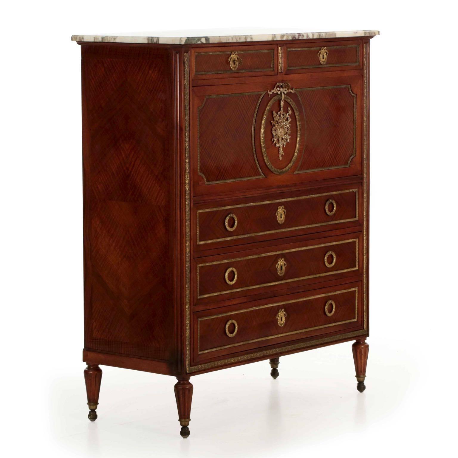 A fine French fall-front secretary desk from the first quarter of the 20th century, this piece was executed by the shop of Maison Forest in Paris and exhibits all of the careful attention to detail found in his work. The vibrant kingwood veneers are